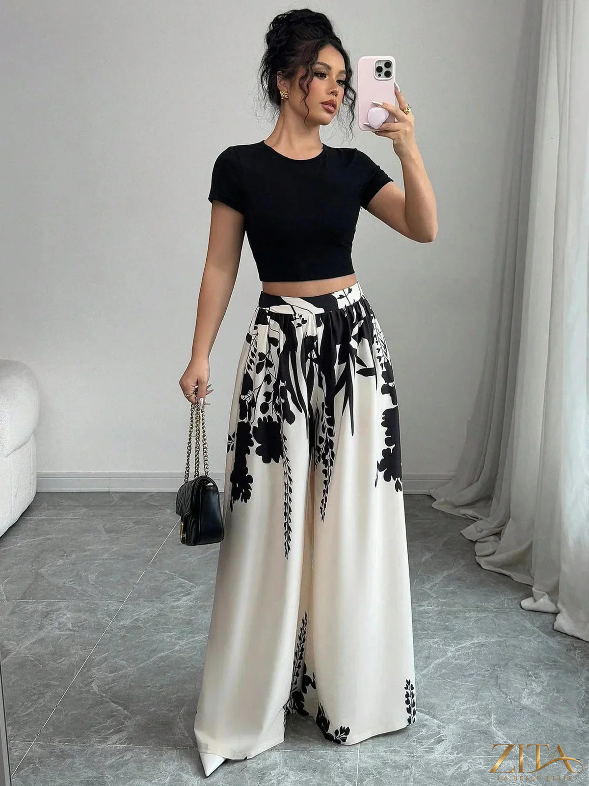 Zita La Belle Elite printed wide-leg pants with floral pattern, high waist, and flowing fabric, styled for a chic, relaxed look.