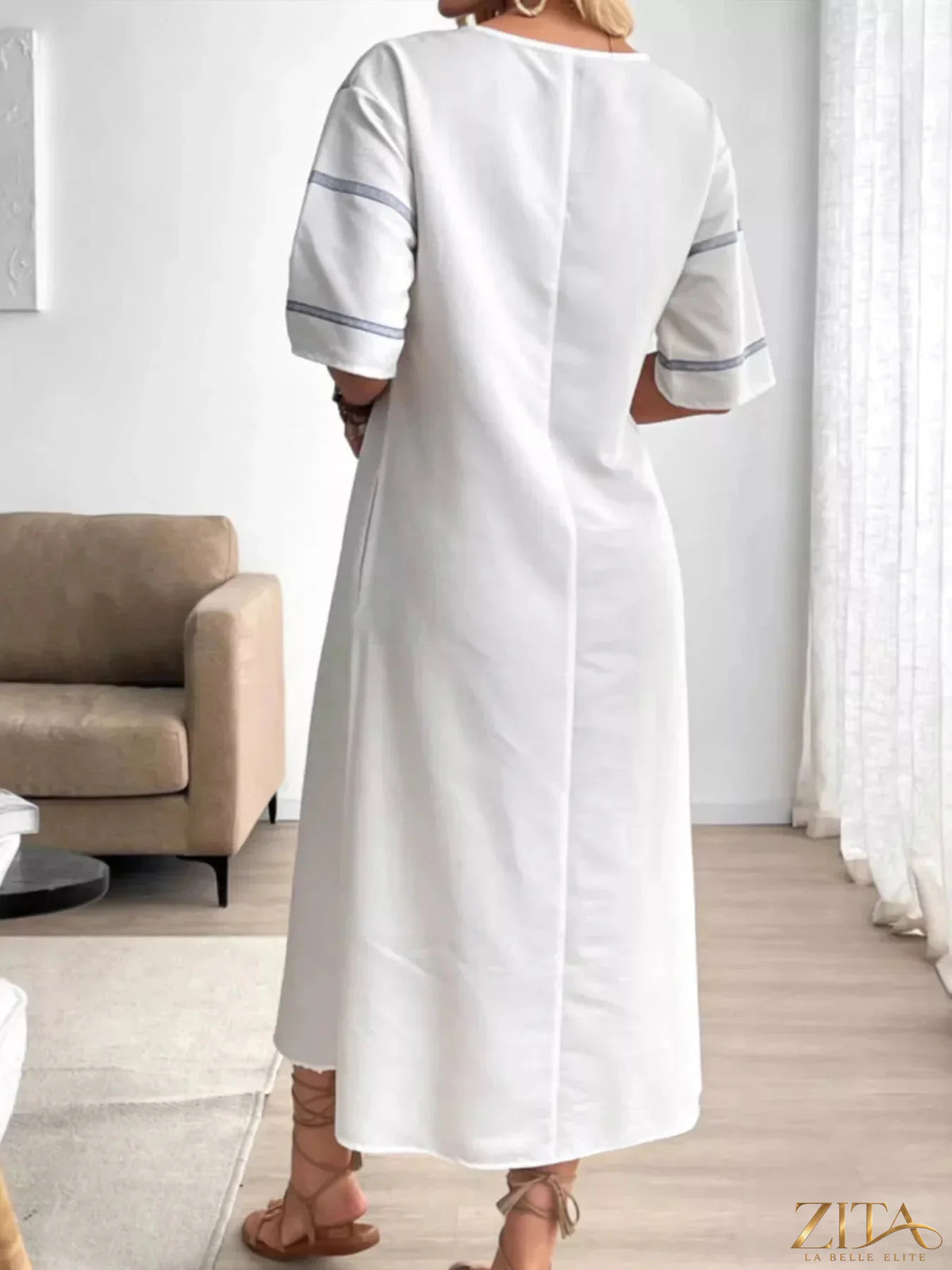 Zita La Belle Elite striped V-neck maxi dress featuring bold vertical stripes and flowing fabric for a stylish summer look.