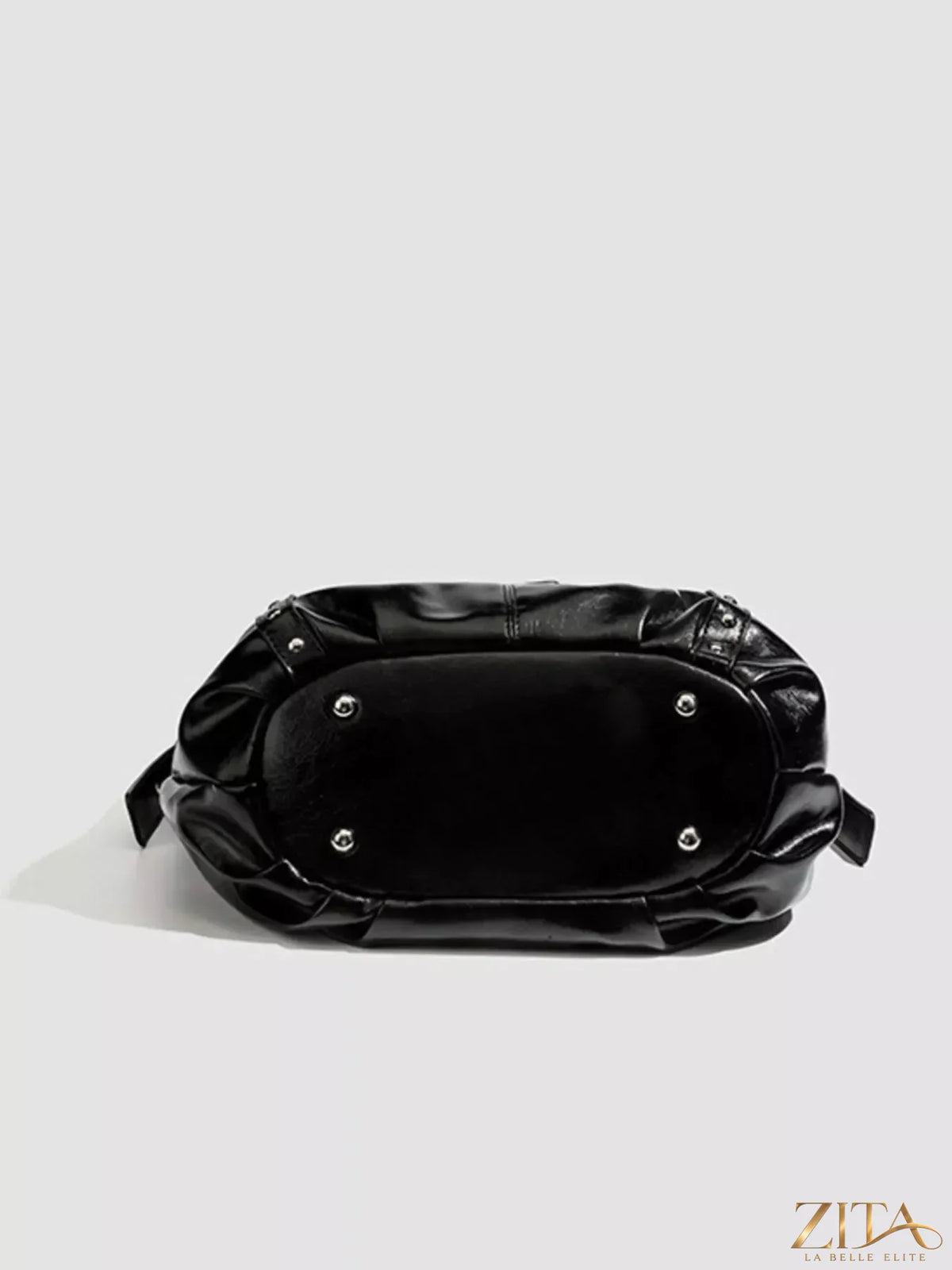 Zita La Belle Elite studded patent leather hobo shoulder bag with silver-tone hardware and adjustable strap.