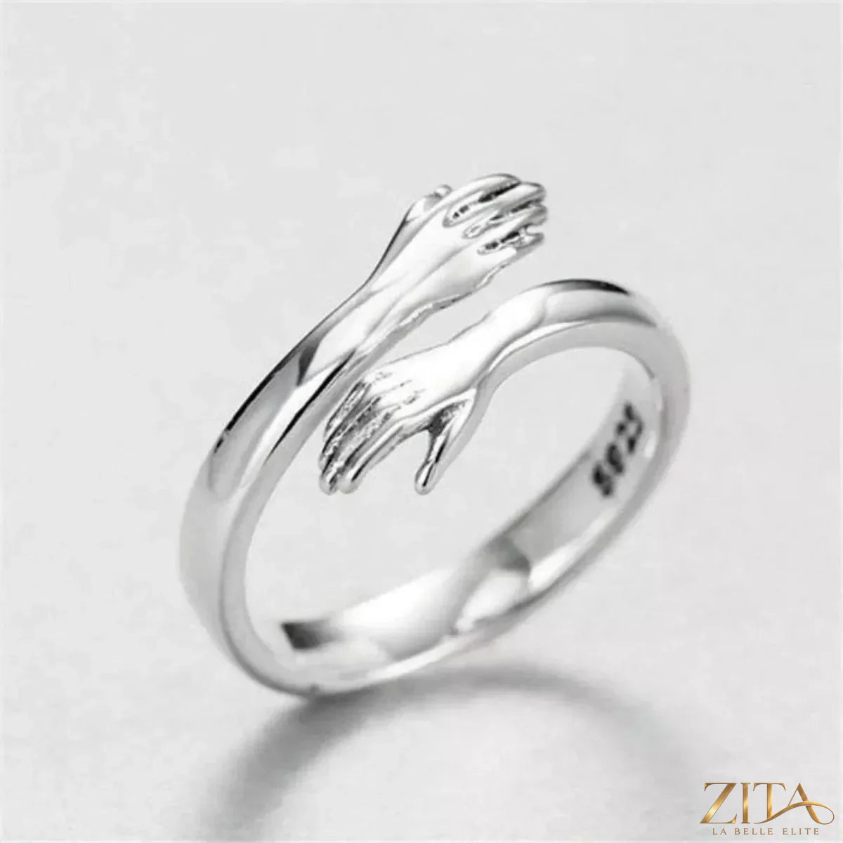 925 Sterling Silver Hug Bypass Ring by Zita La Belle Elite, featuring a sleek, modern design with intertwined band details.
