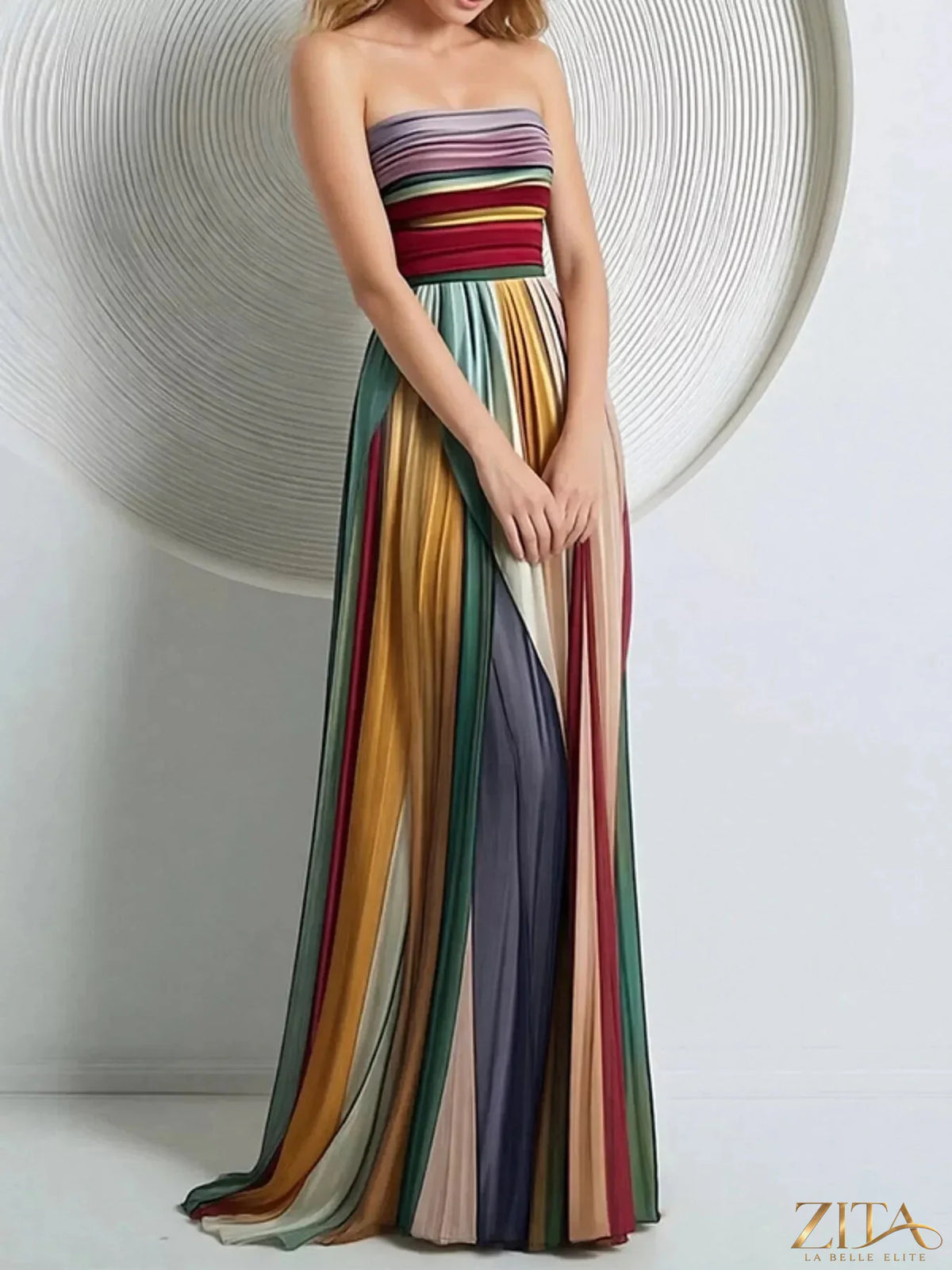 Zita La Belle Elite striped pleated tube maxi dress featuring a fitted bodice and flowing skirt with bold vertical stripes.