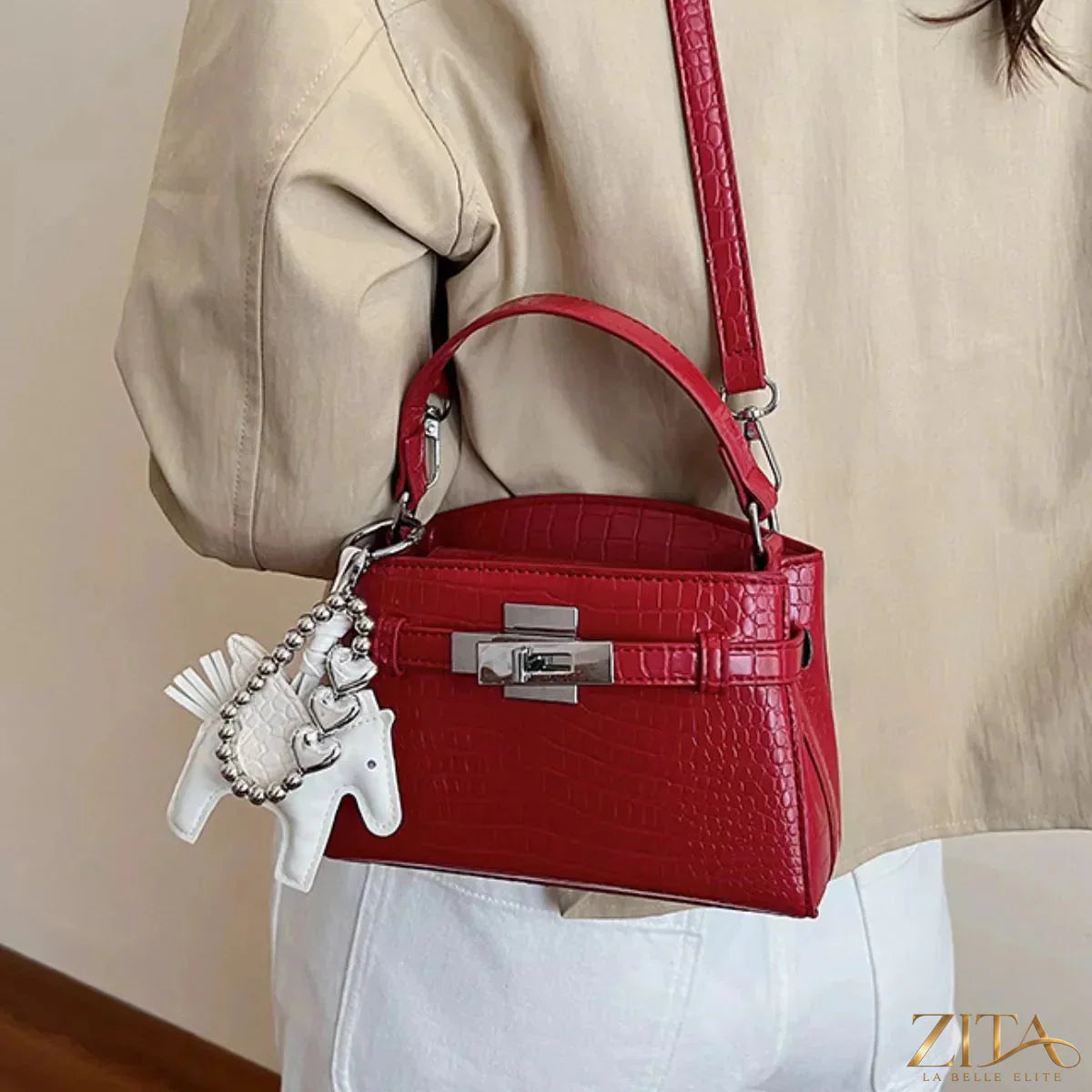 Crocodile-embossed top-handle handbag by Zita La Belle Elite, featuring a sleek design and textured crocodile pattern.