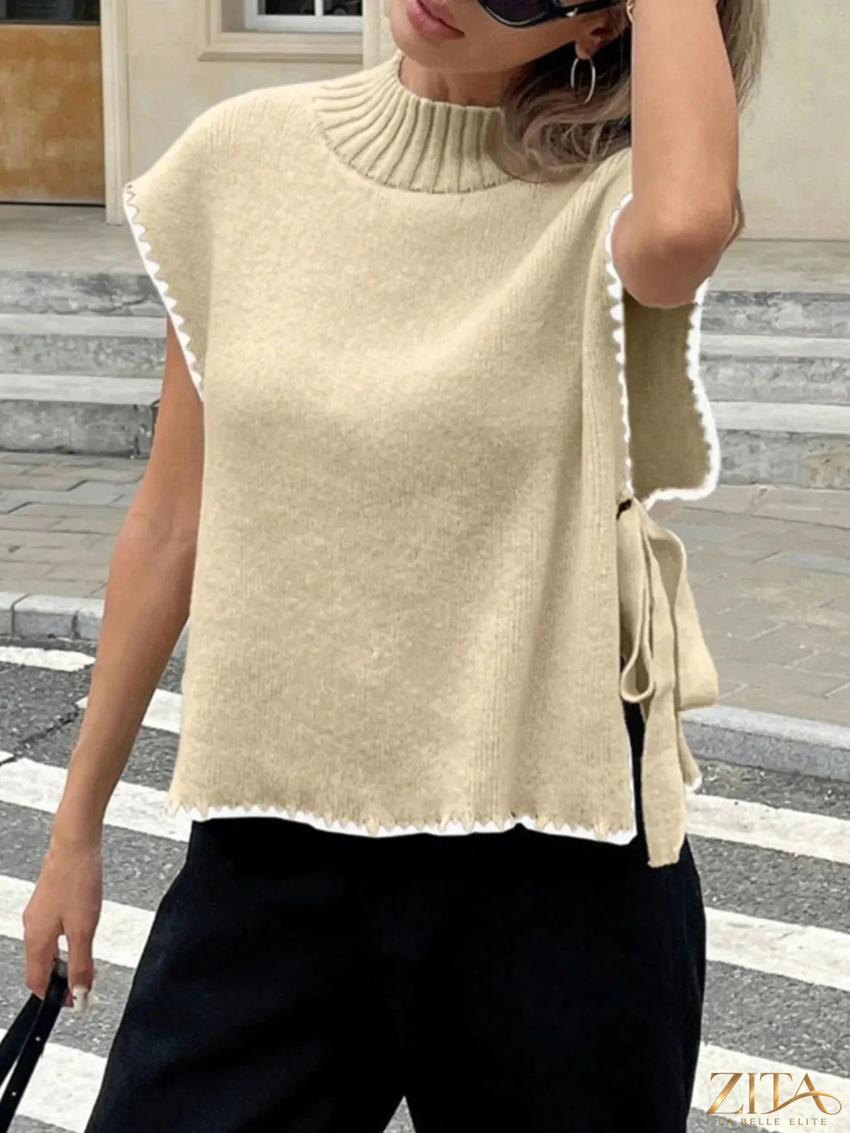 Ribbed turtleneck sweater vest with contrast trim, stylish and cozy, by Trendsi, showcasing the detailed ribbed knit fabric.
