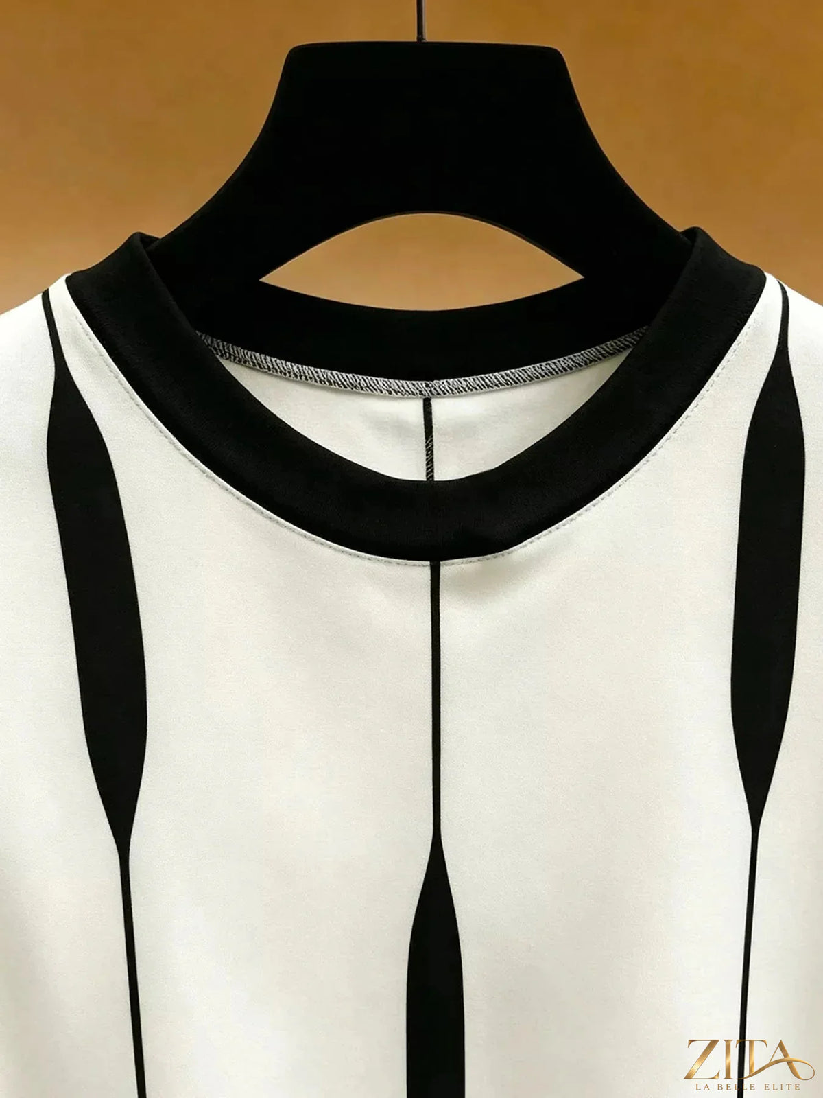 Zita La Belle Elite contrast vertical stripe long sleeve blouse with button front and relaxed fit, in black and white vertical stripes.