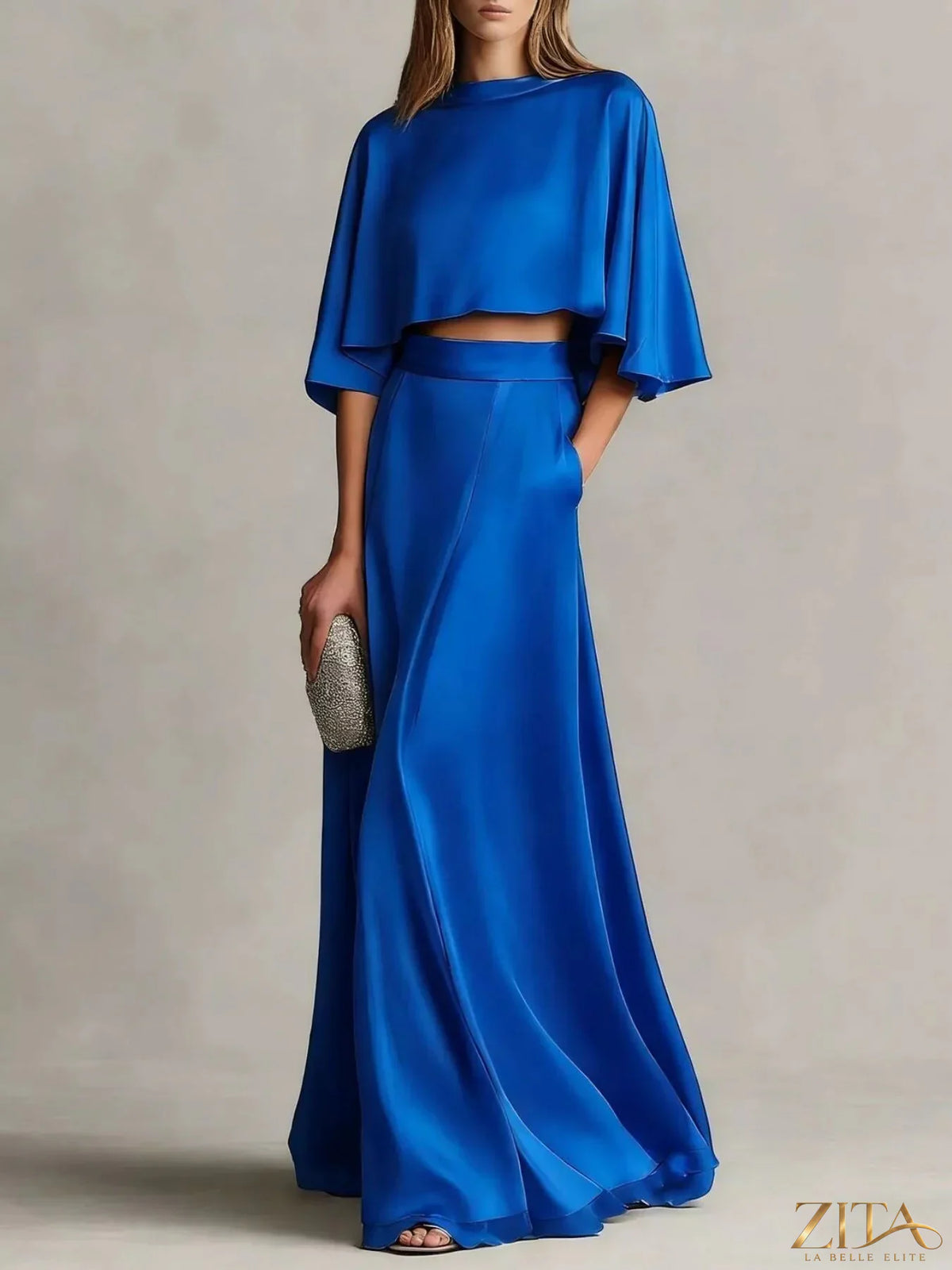 Plus size satin crop top and maxi skirt set by Zita La Belle Elite, stylish two-piece ensemble with a smooth satin finish.