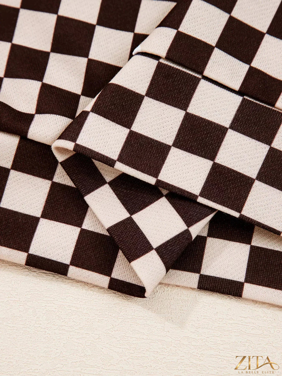 Checkered drawstring hoodie and pants set by Zita La Belle Elite, featuring a stylish matching design and comfortable fit.