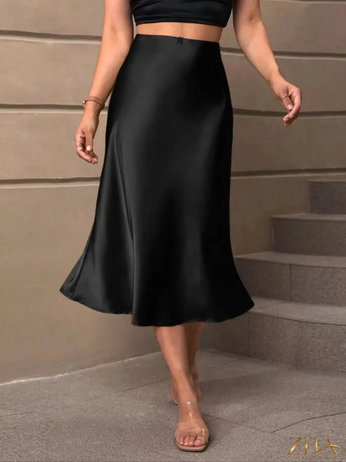 Satin midi skirt from Trendsi featuring a smooth, flowing fabric and a stylish mid-length design, perfect for elegant outfits.
