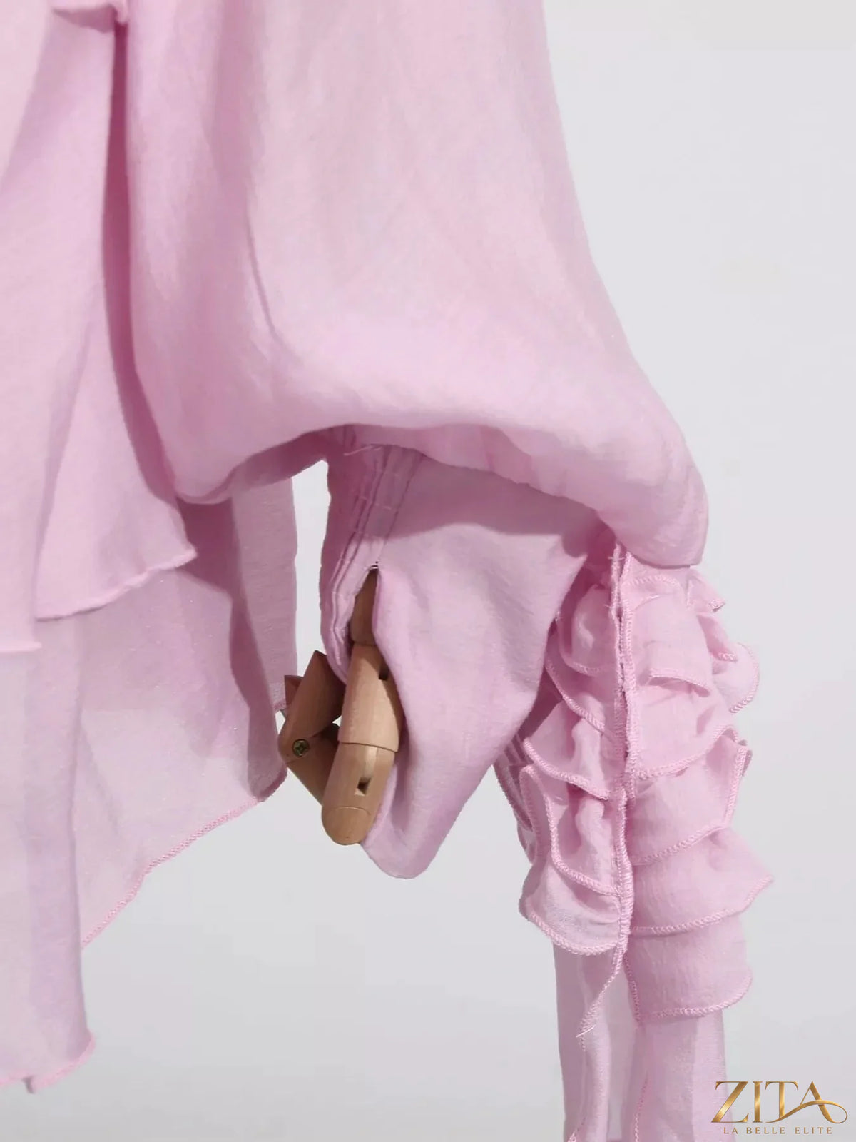 Ruffled long sleeve mini dress by Trendsi featuring a feminine design with ruffle details and a fitted silhouette.