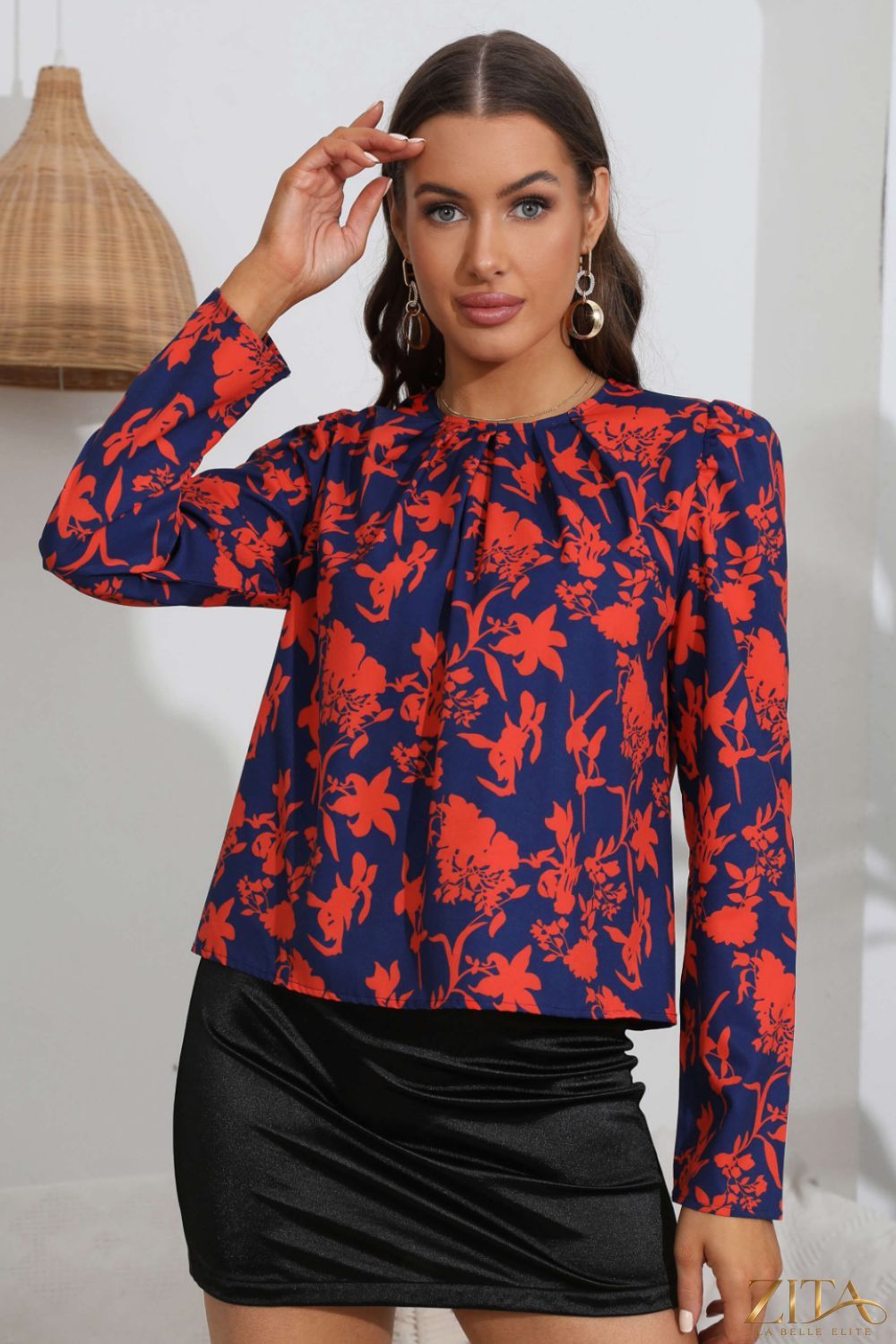 Zita La Belle Elite floral long puff sleeve blouse featuring a feminine design with vibrant floral patterns and ruffled details.