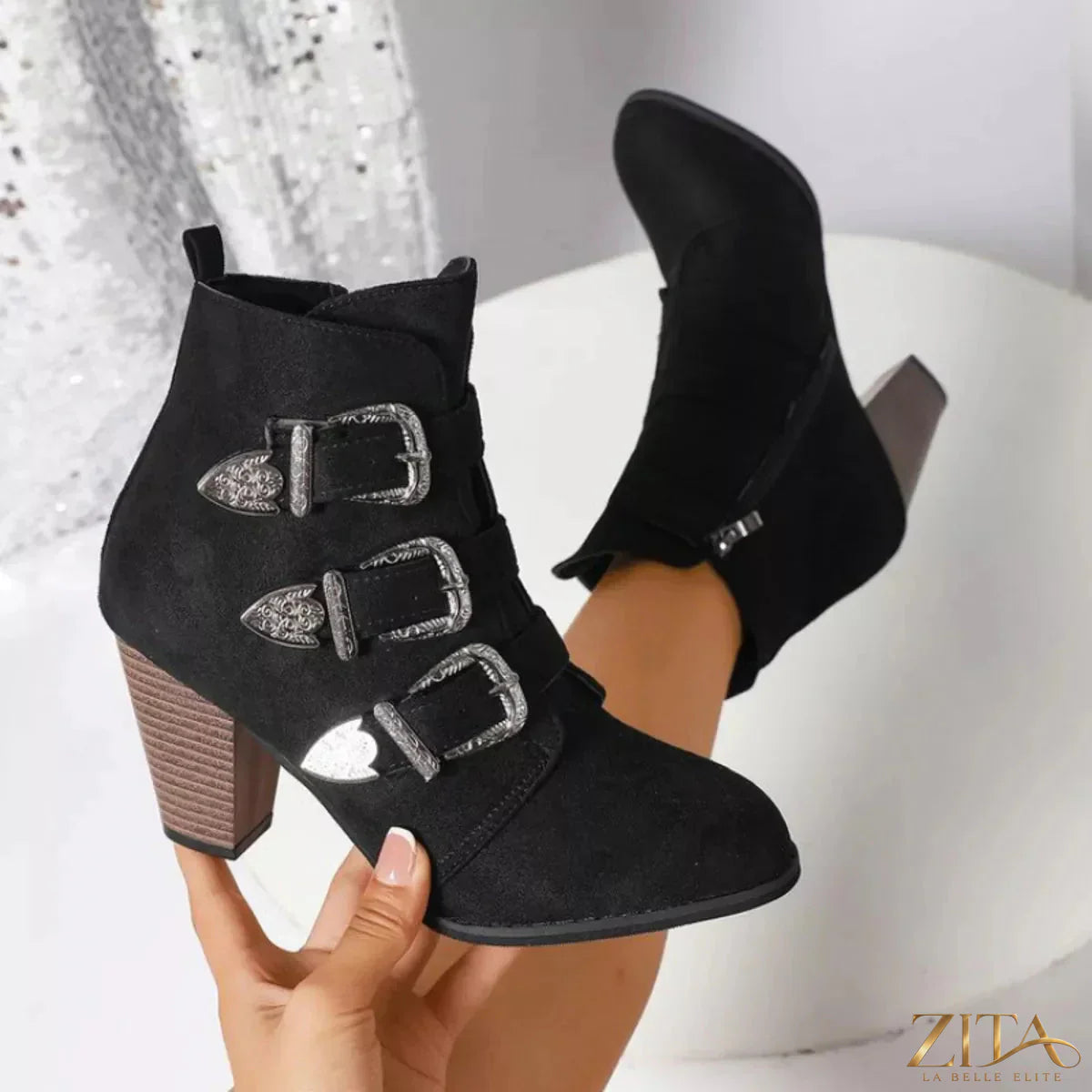 Point toe block heel boots by Trendsi featuring sleek design, ankle height, and stylish silhouette.