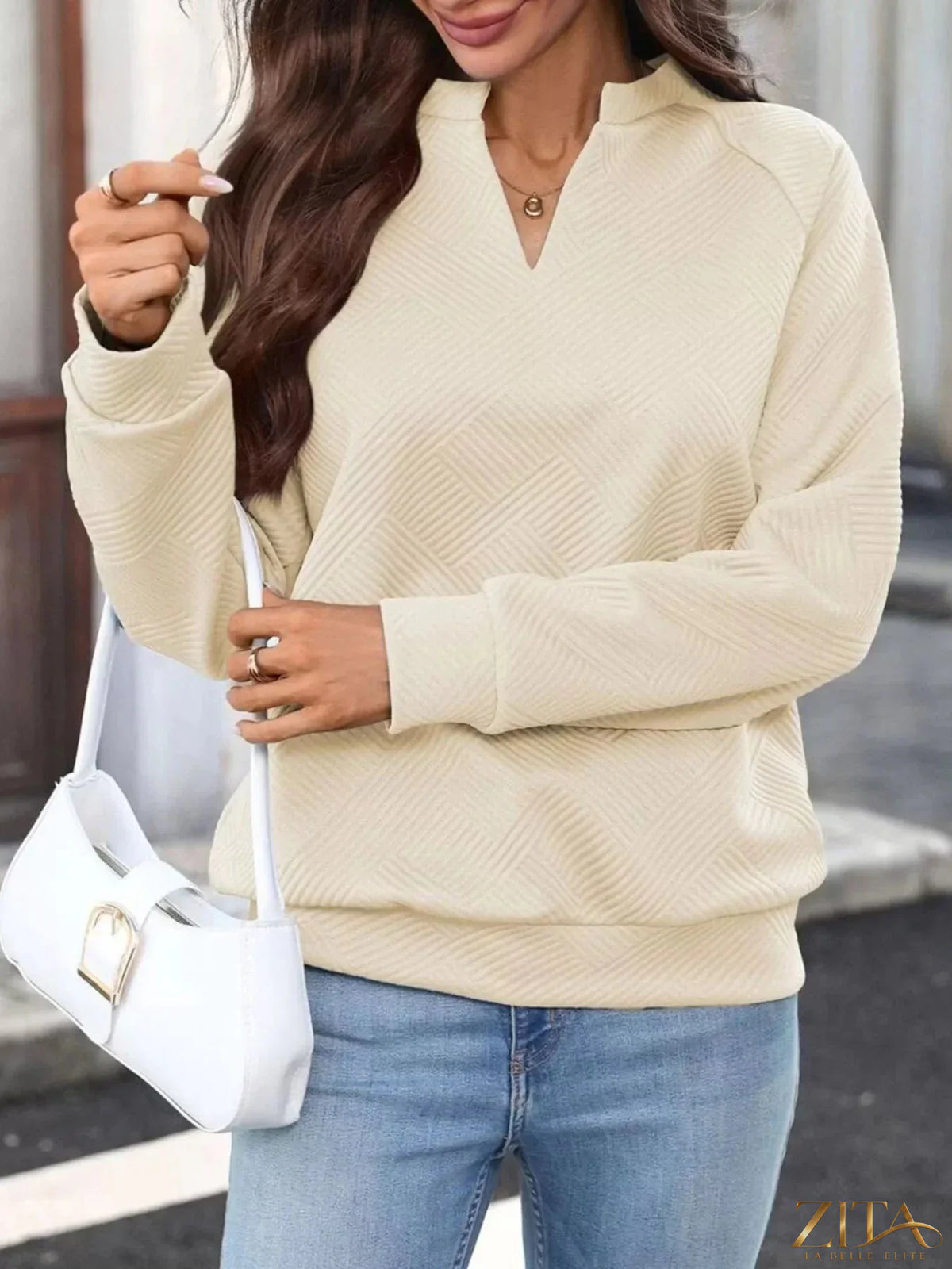 Zita La Belle Elite textured notched long sleeve sweatshirt in neutral color with a relaxed fit and stylish design.