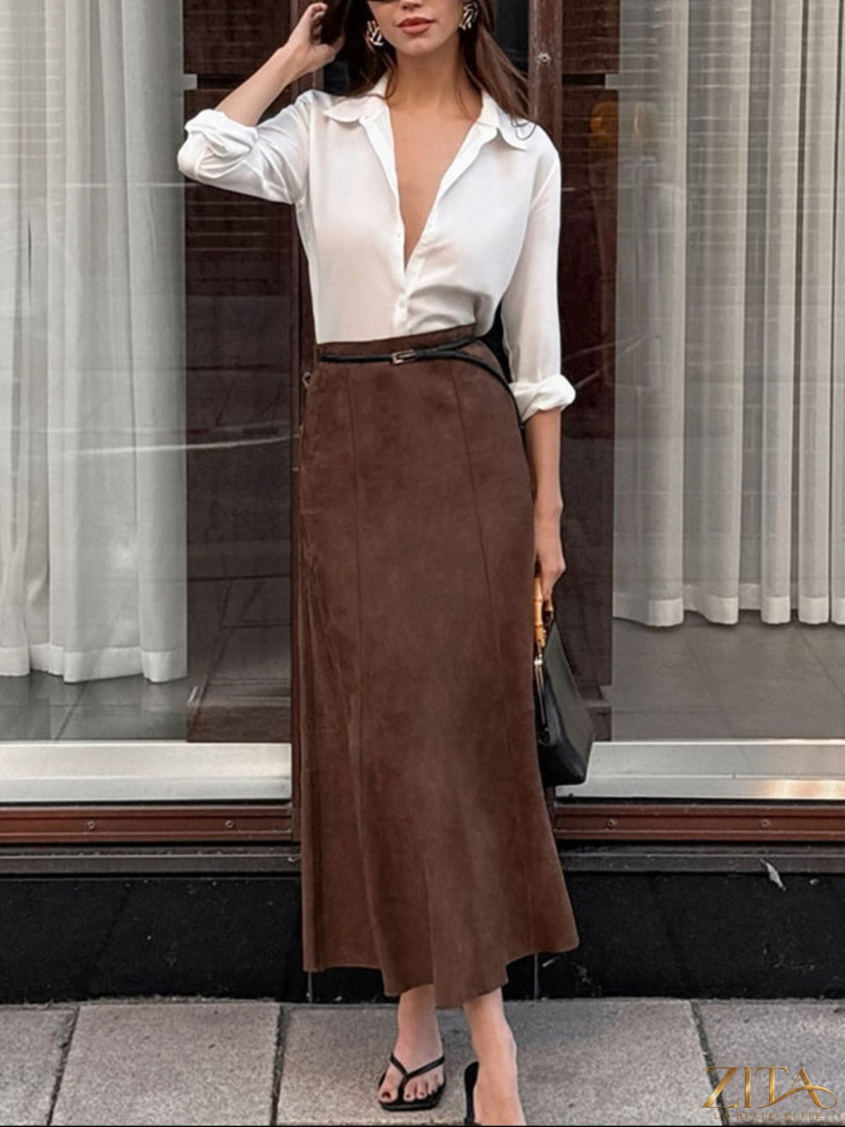 Trendsi suede midi skirt in soft beige fabric, high waistband, and sleek A-line silhouette, perfect for stylish everyday wear.