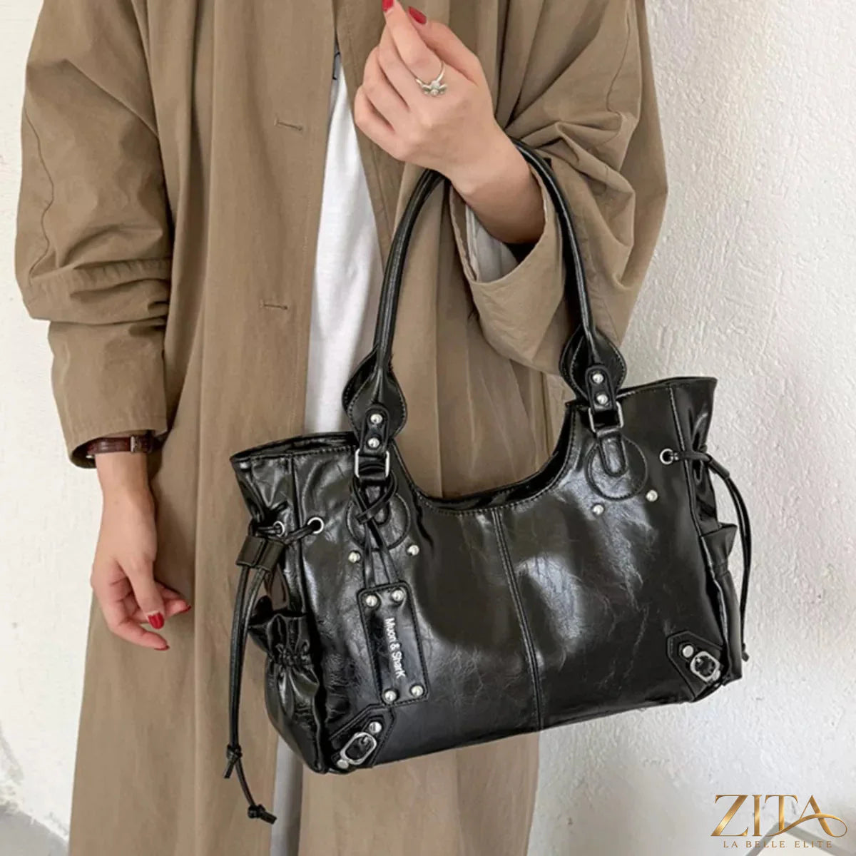 Drawstring leather handbag by Trendsi featuring a sleek design, adjustable drawstring closure, and stylish leather accents.