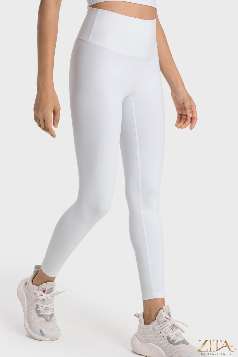 Millennia high-rise wide waistband yoga leggings by Trendsi, black stretchy leggings with comfortable fit and modern design.