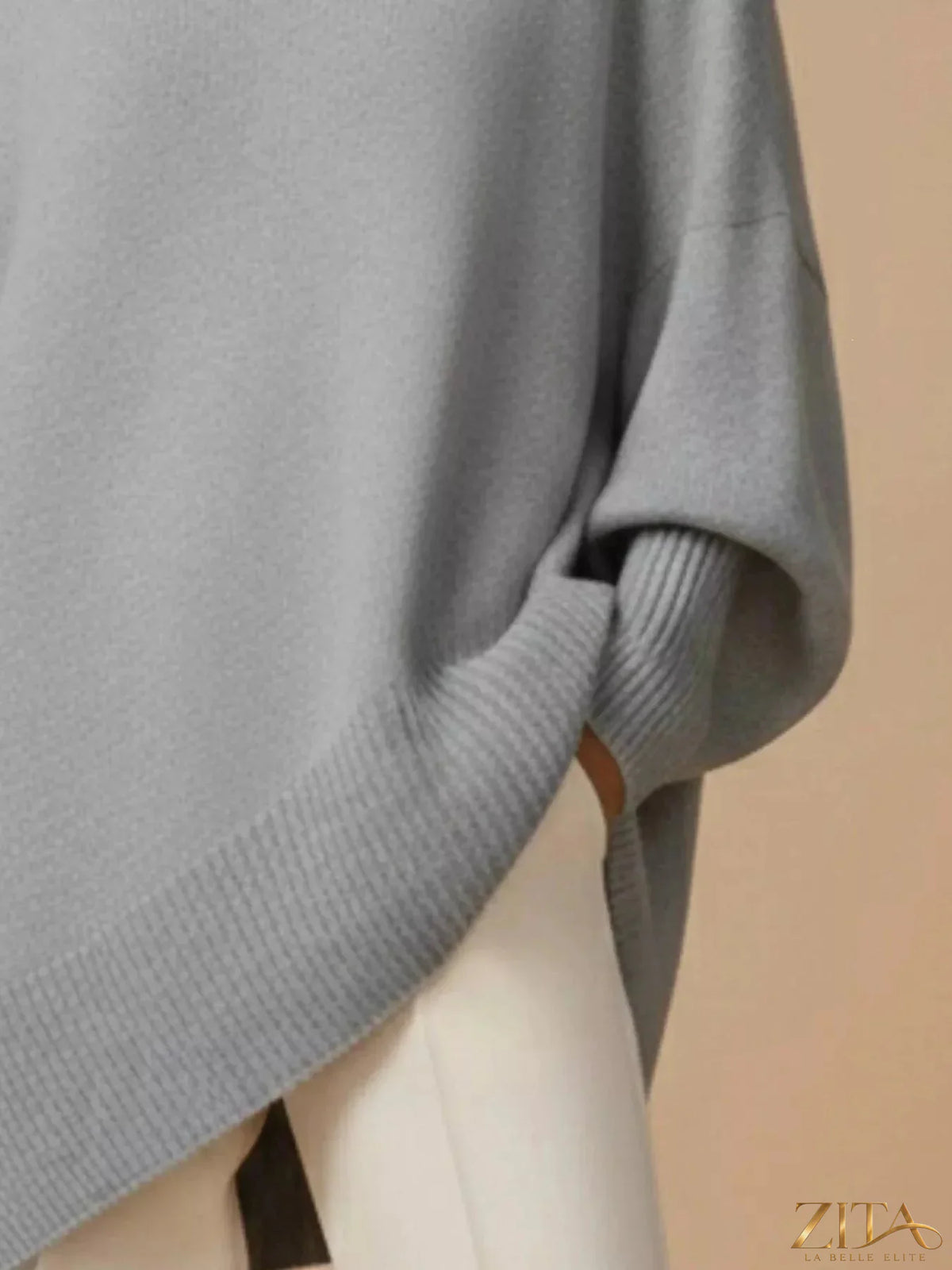 Oversized dropped shoulder sweater by Trendsi, soft knit fabric, relaxed fit, with long sleeves and a cozy casual style.