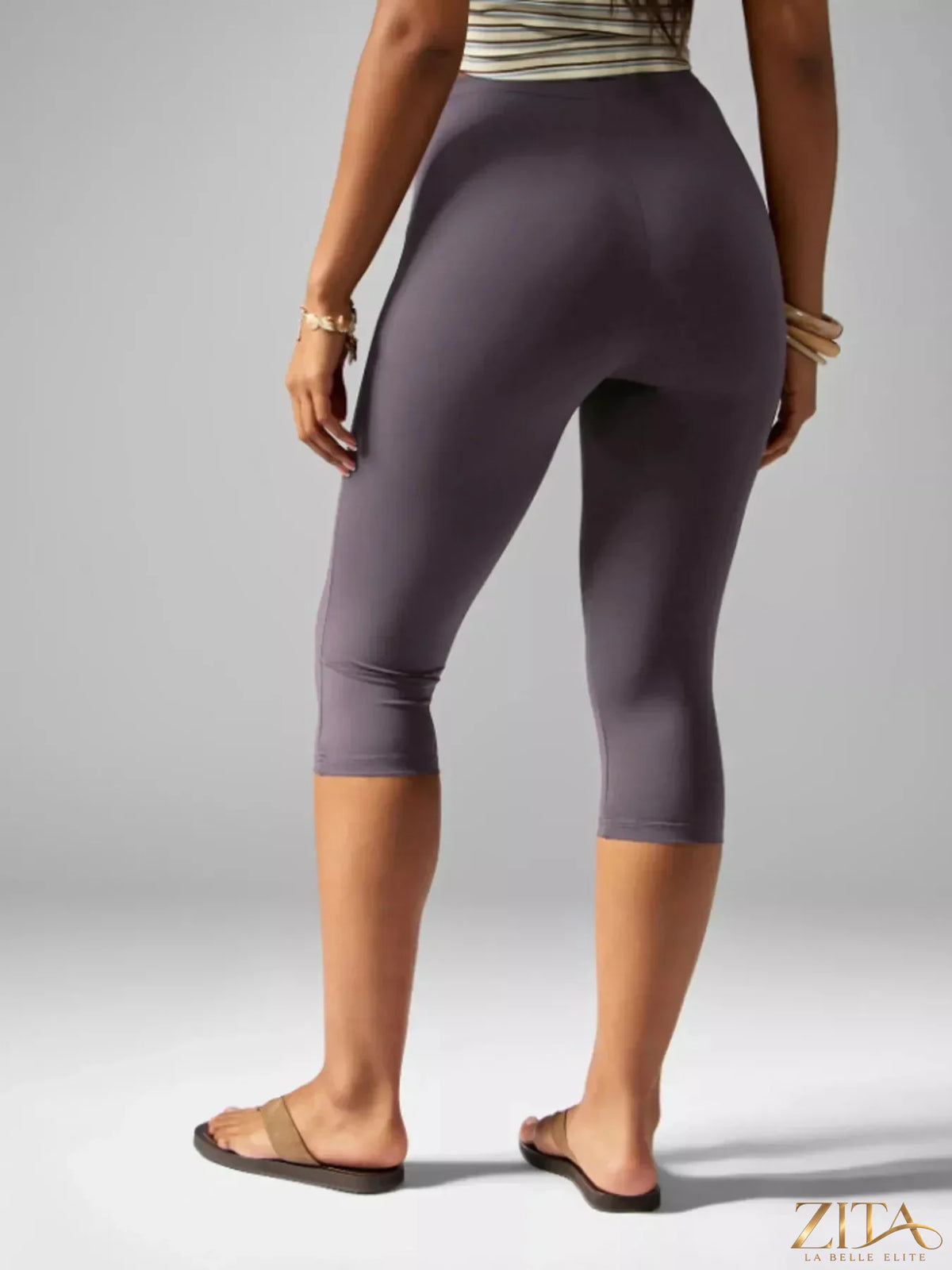 Zita La Belle Elite high-waisted active capri leggings in black, shown on a model, with a stretchy, form-fitting design for workout wear.
