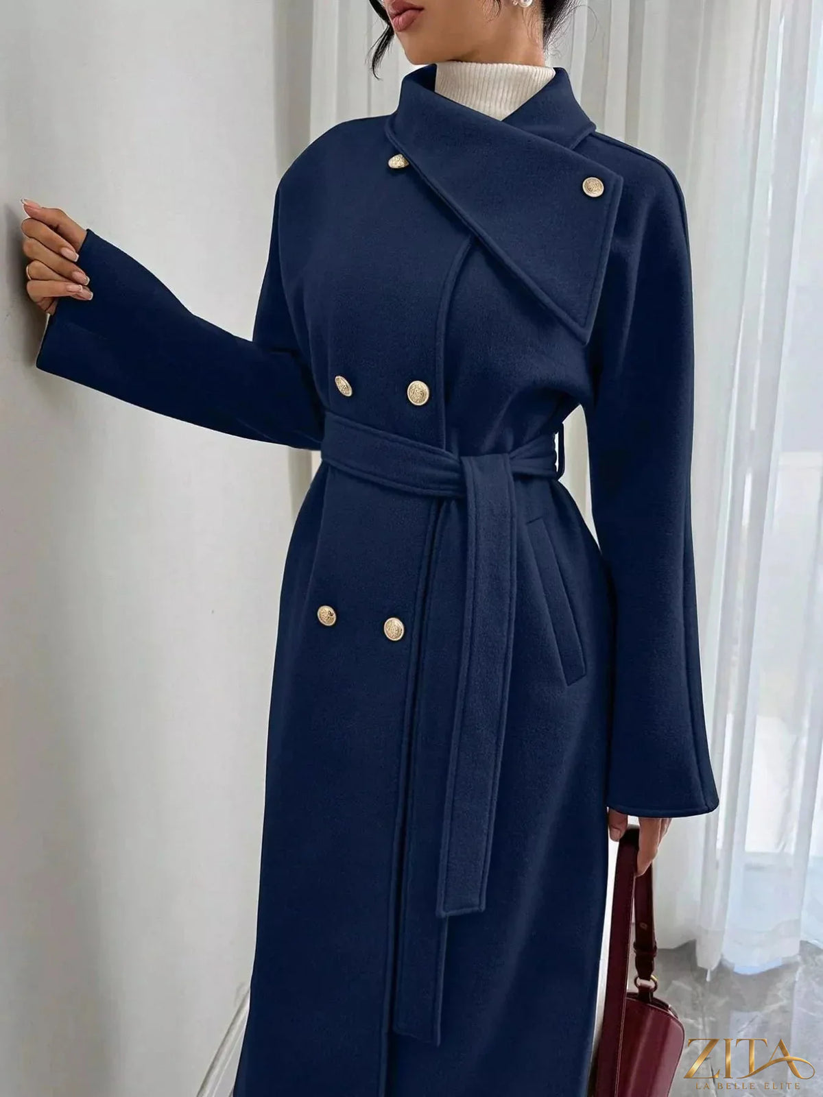Zita La Belle Elite double-breasted longline coat in neutral fabric, showcasing a stylish collar and tailored fit.