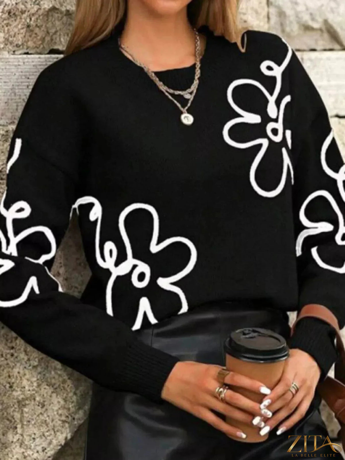 Flower dropped shoulder sweater by Trendsi featuring a soft knit fabric and floral design on the shoulders.