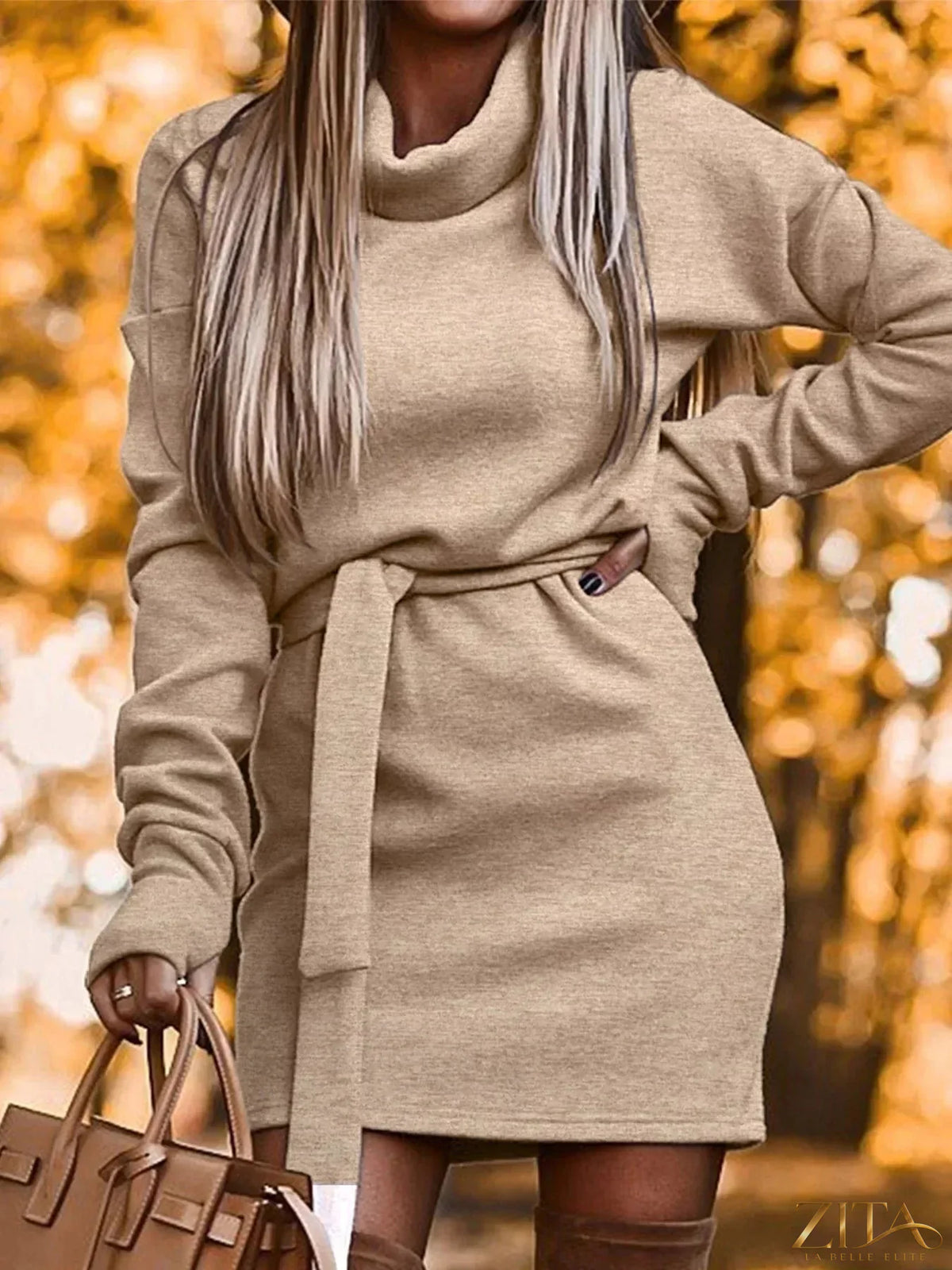 Zita La Belle Elite turtleneck belted knit dress featuring a fitted silhouette and ribbed texture, displayed on a neutral background.