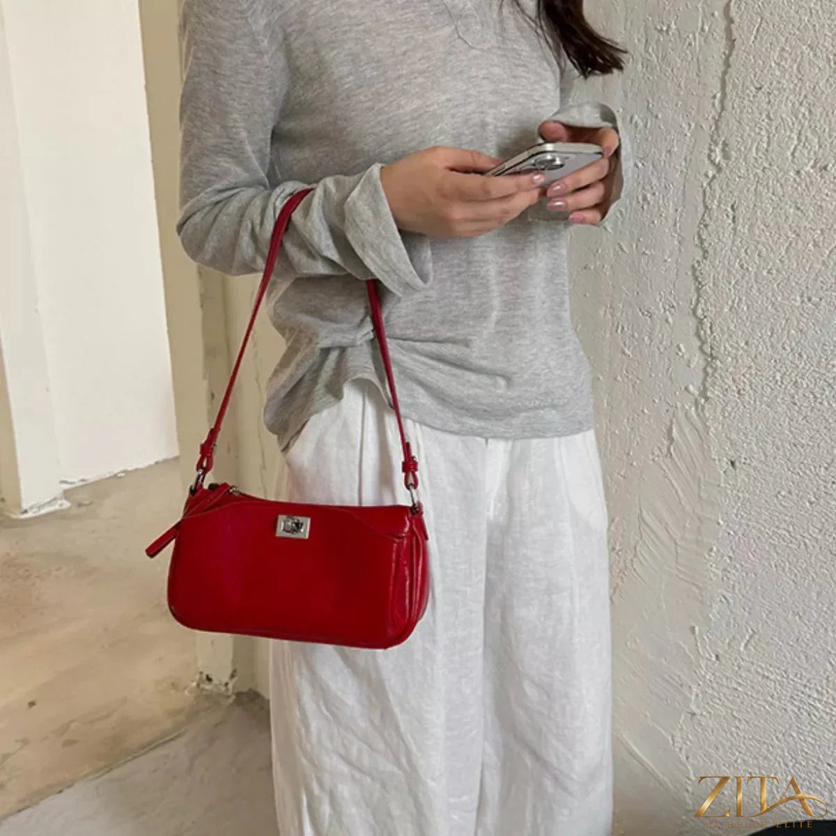 Trendsi PU leather shoulder bag with adjustable strap, featuring a sleek design and spacious interior for everyday use.