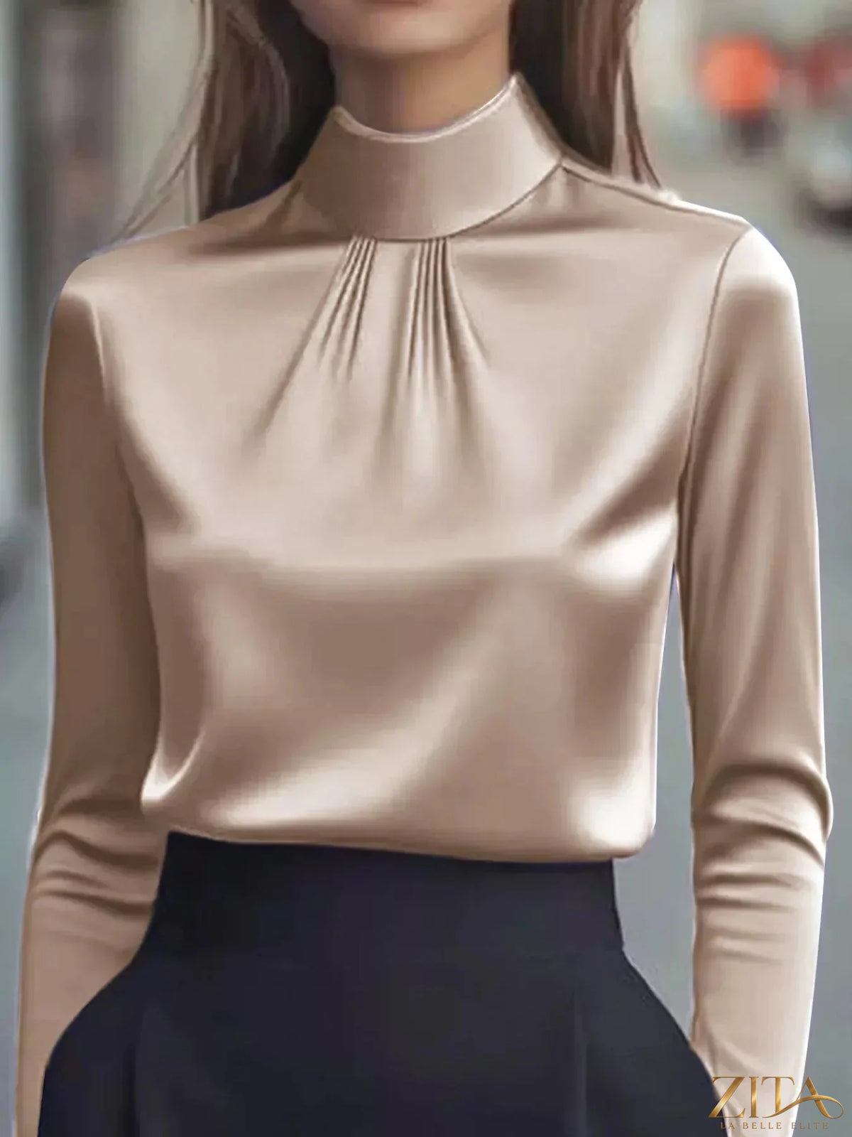 Zita La Belle Elite mock neck long sleeve blouse with pleated detail, featuring a fitted silhouette and elegant design.