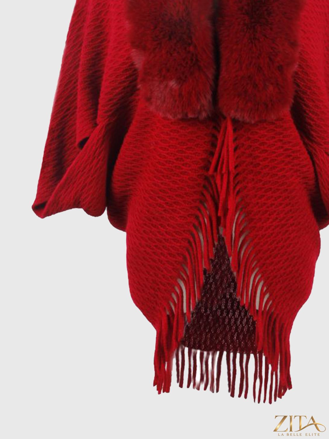 Open front fringe hem poncho by Trendsi, showcasing a stylish draped design with fringe details on the hem.