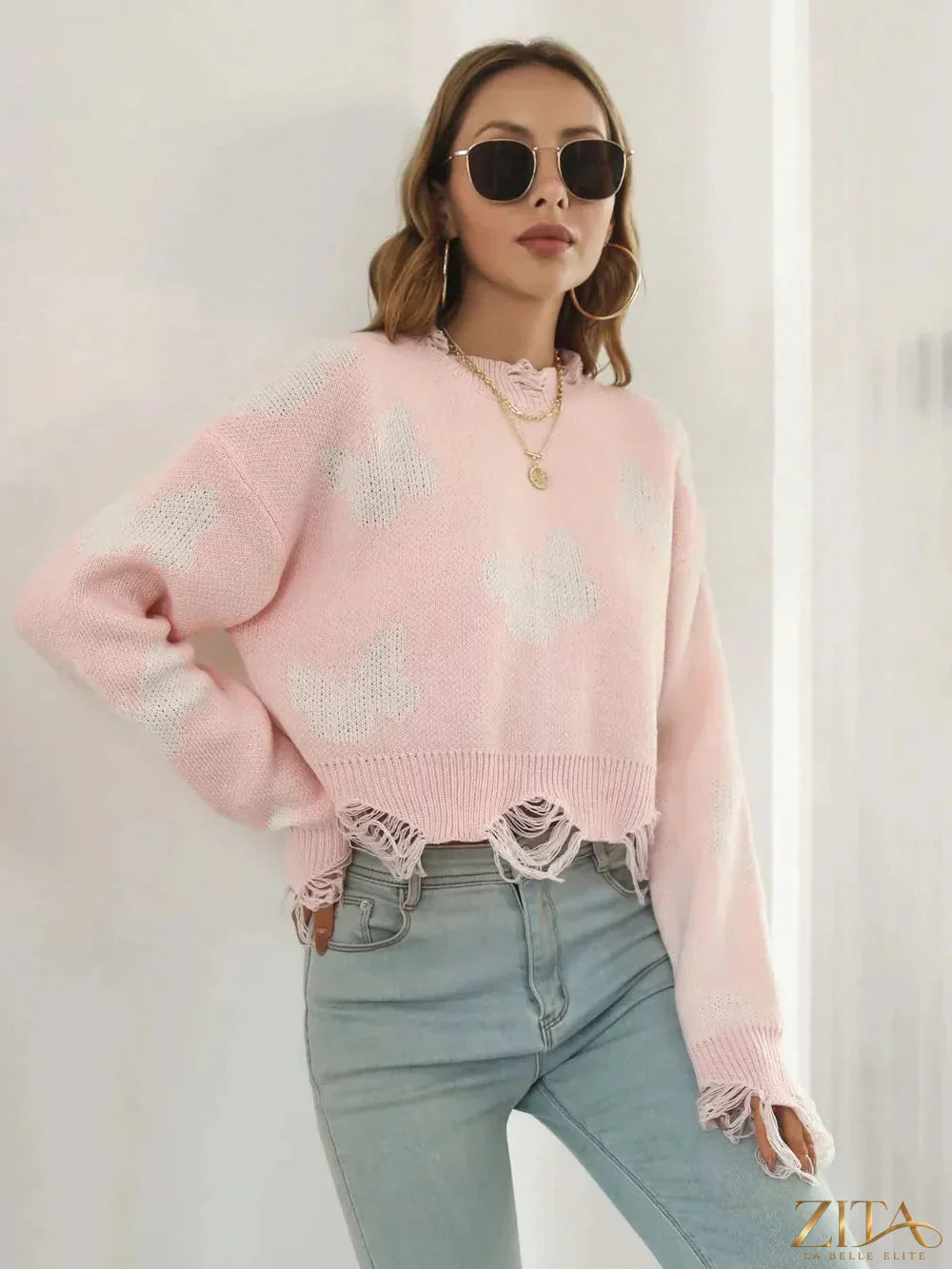 Zita La Belle Elite distressed butterfly cropped sweater featuring a worn, fashionable look with butterfly details and a cropped fit.