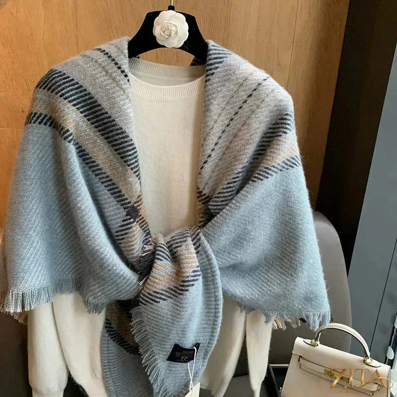Raw hem plaid scarf by Trendsi featuring a cozy, soft fabric with a classic plaid pattern and frayed edges for a stylish look.