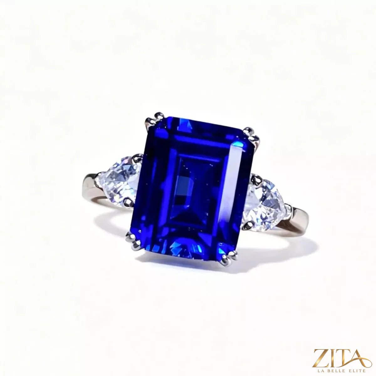 925 sterling silver sapphire geometric ring with blue gemstone and modern design, featuring sleek silver band and angular pattern.