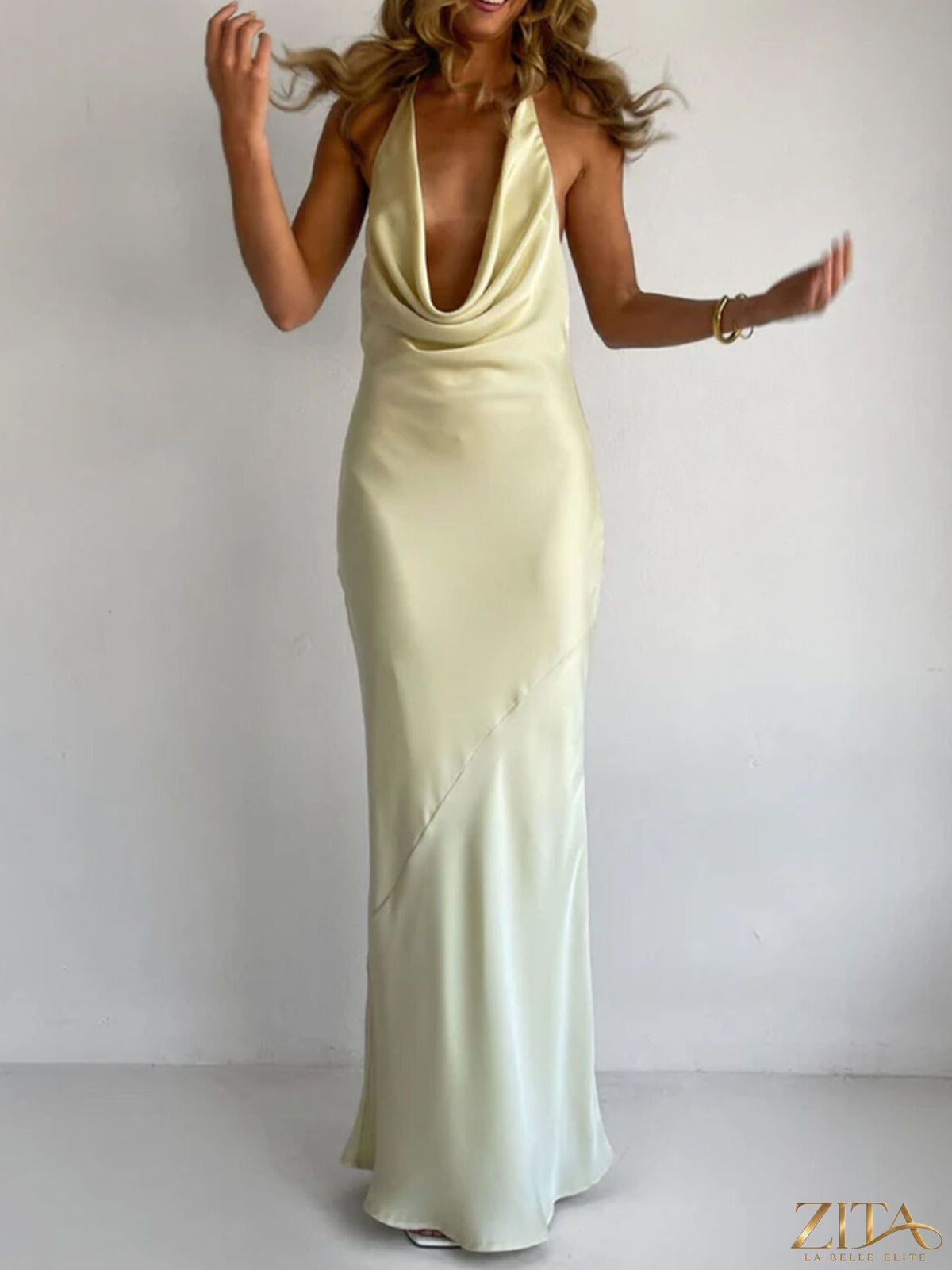 Zita La Belle Elite halter neck satin maxi dress displayed on a model, featuring a flowing silhouette and elegant design.