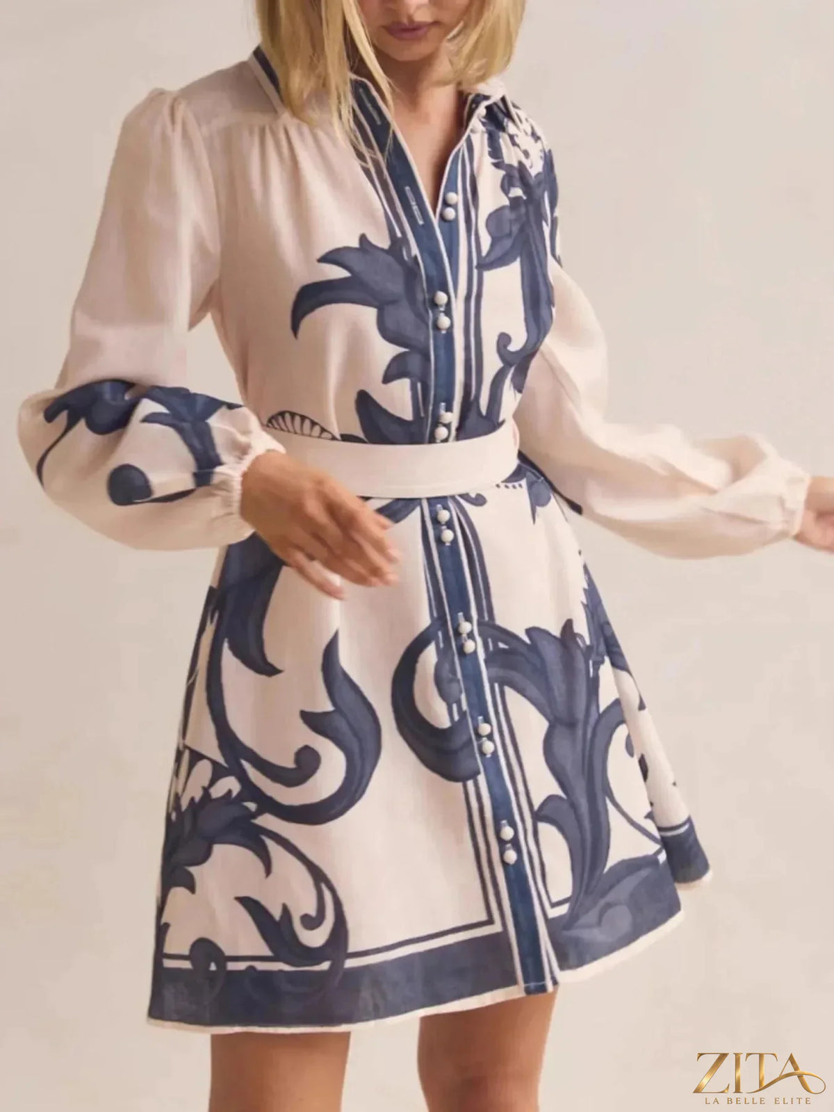 Printed long sleeve shirt dress by Trendsi featuring a casual, stylish design with a button-down front and relaxed fit.