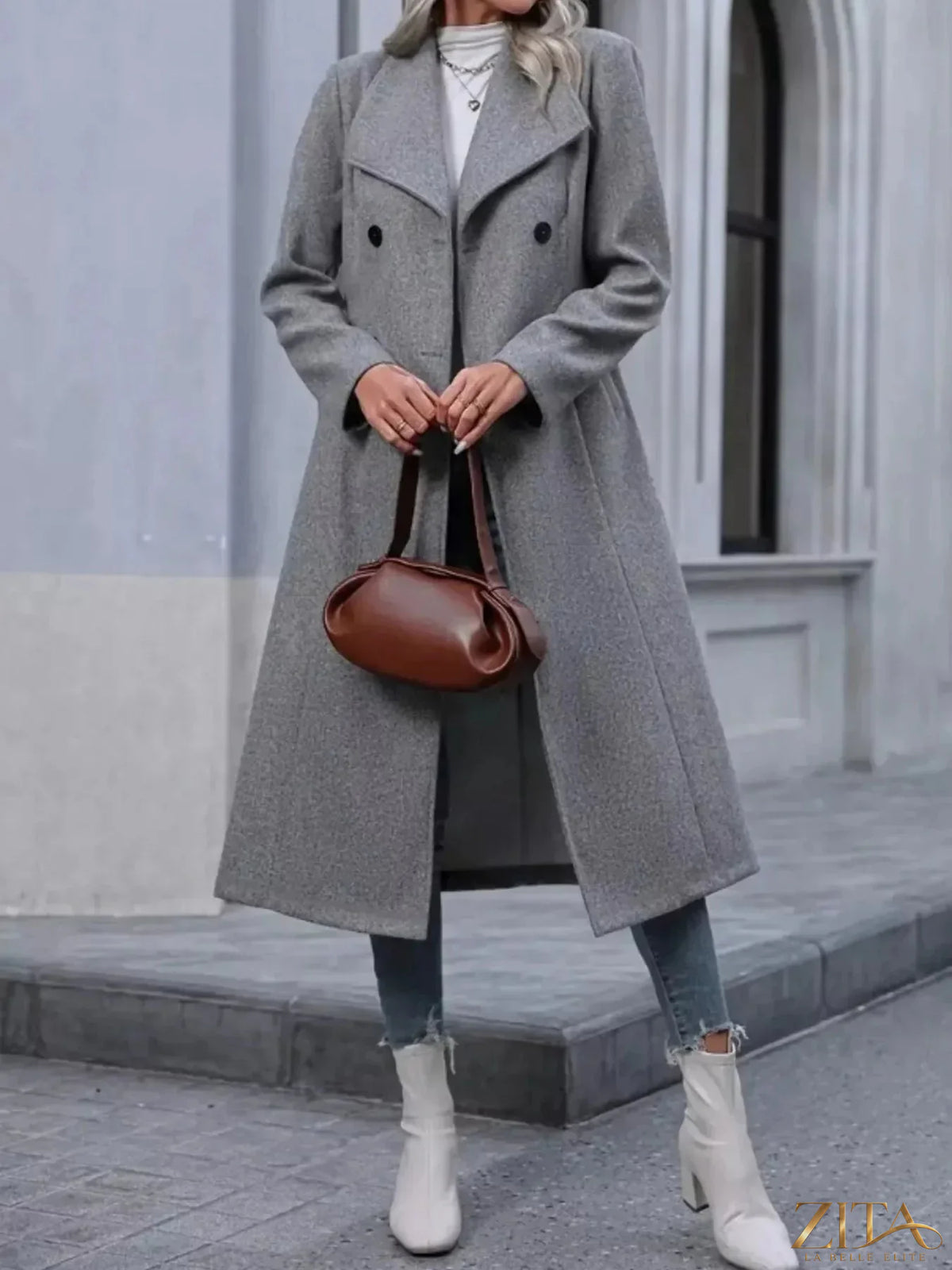 Zita La Belle Elite double-breasted longline overcoat in dark fabric, tailored with wide lapels and a sleek, elegant silhouette.