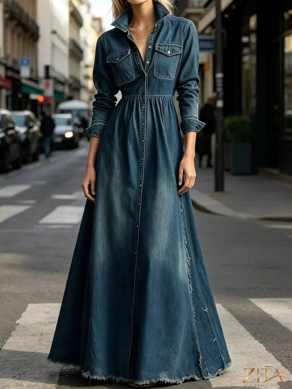 Raw hem long-sleeve denim maxi dress by Zita La Belle Elite, featuring a flowing silhouette and casual raw hem details.