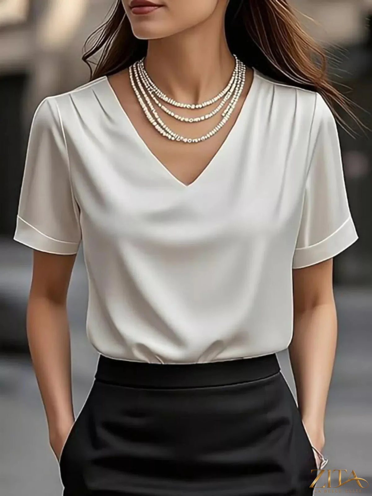 Zita La Belle Elite V-neck short sleeve satin blouse in a sleek, smooth fabric with a relaxed fit and elegant design.