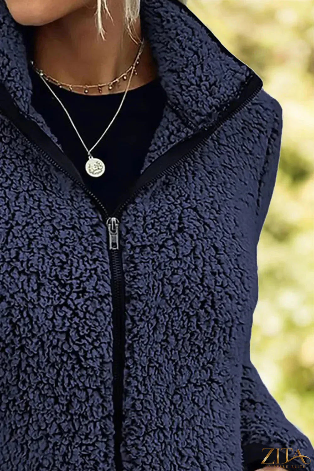 Black pocketed zip-up turtleneck jacket by Trendsi featuring a fitted design and front zip closure.