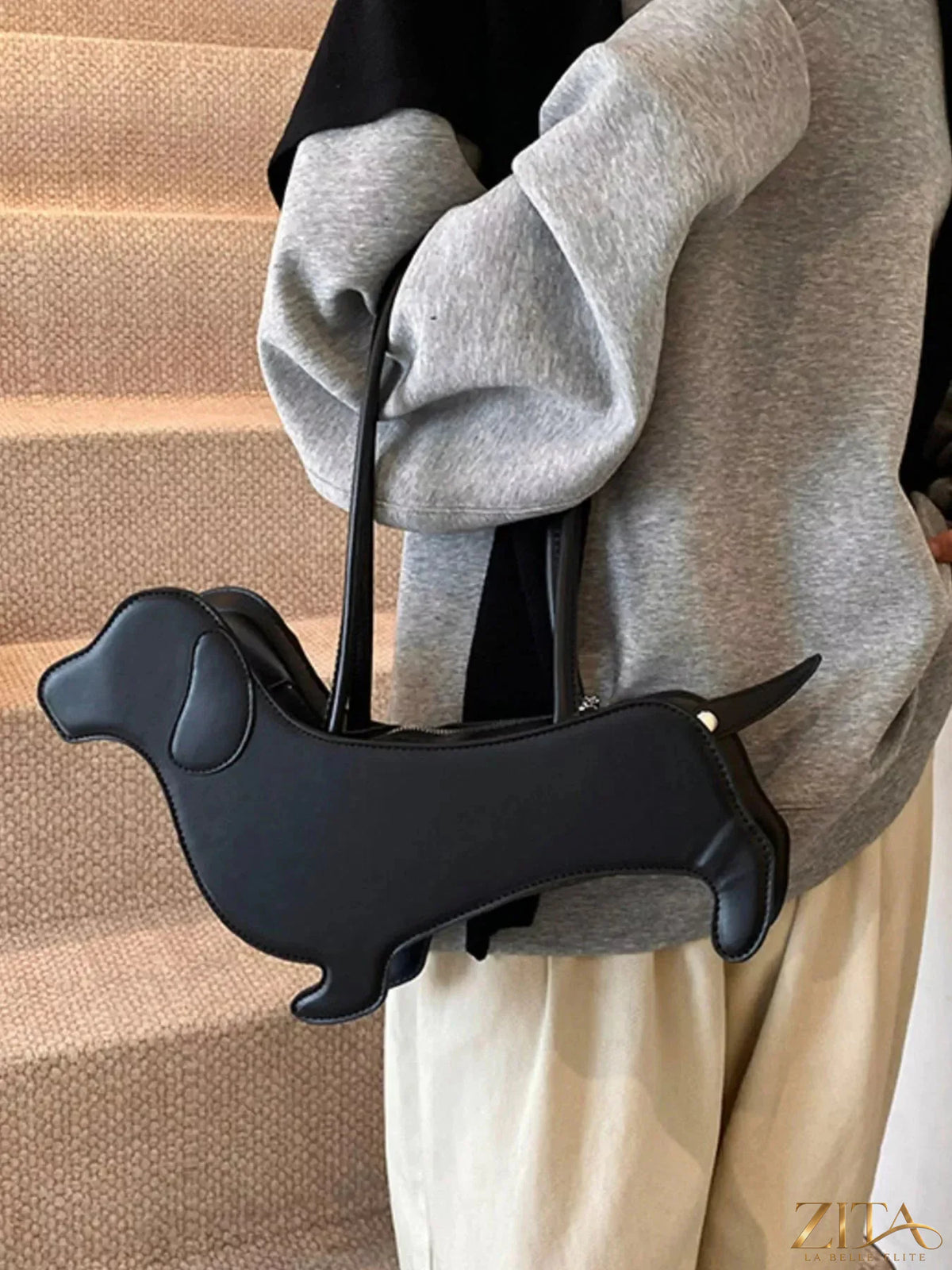 Zita La Belle Elite dachshund-shaped shoulder bag featuring a detailed dog design and adjustable strap on a white background.