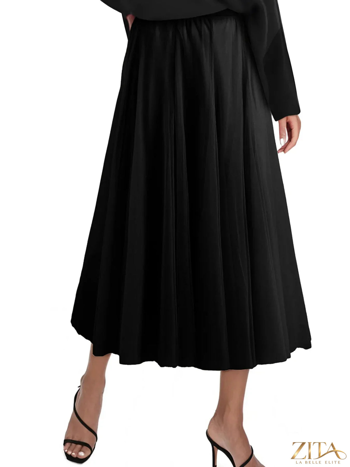 High-waisted midi skirt by Trendsi featuring a flowy silhouette and stylish design, shown in a side view.
