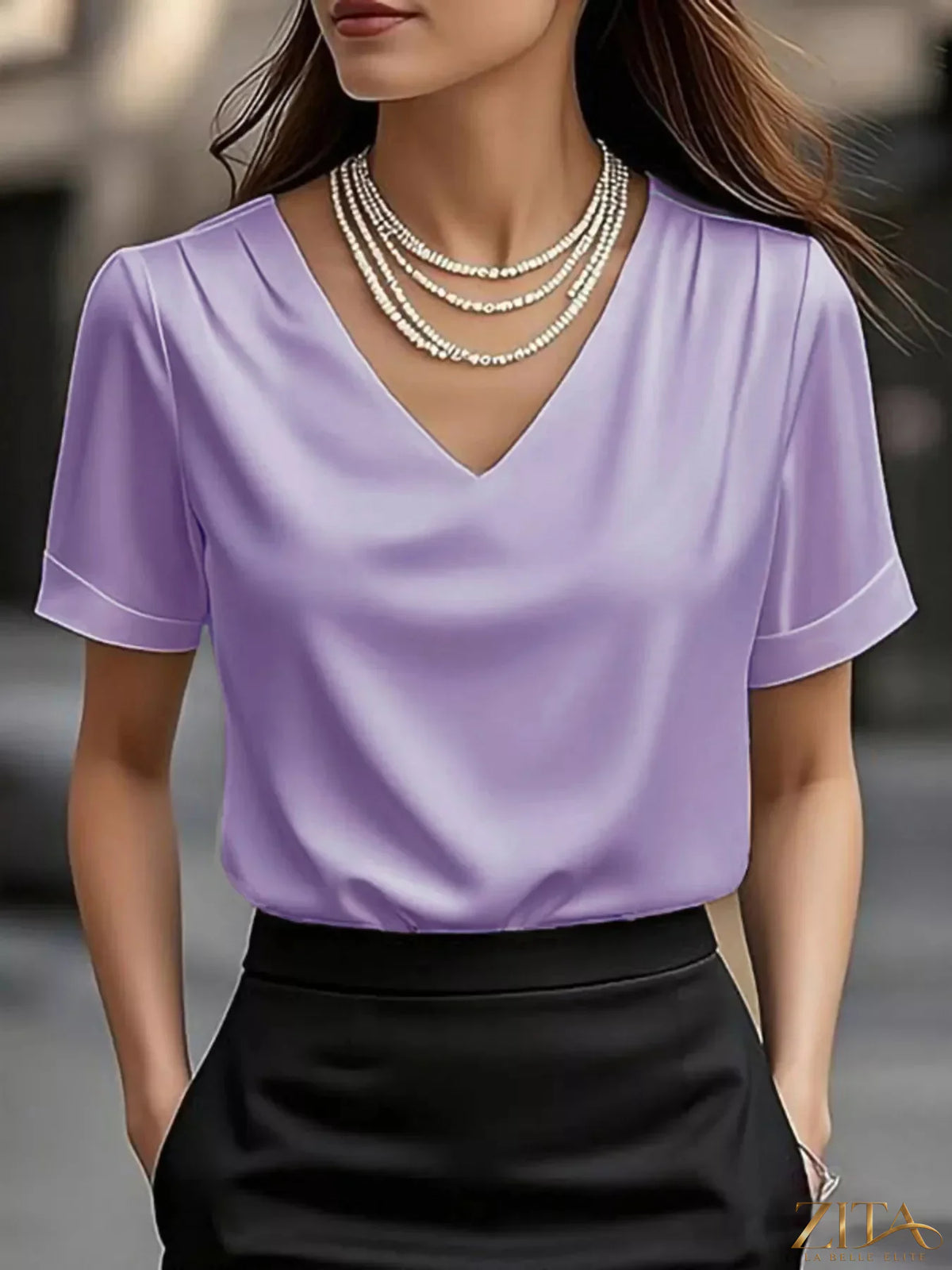 Zita La Belle Elite V-neck short sleeve satin blouse in a sleek, shiny fabric, displayed on a white background.