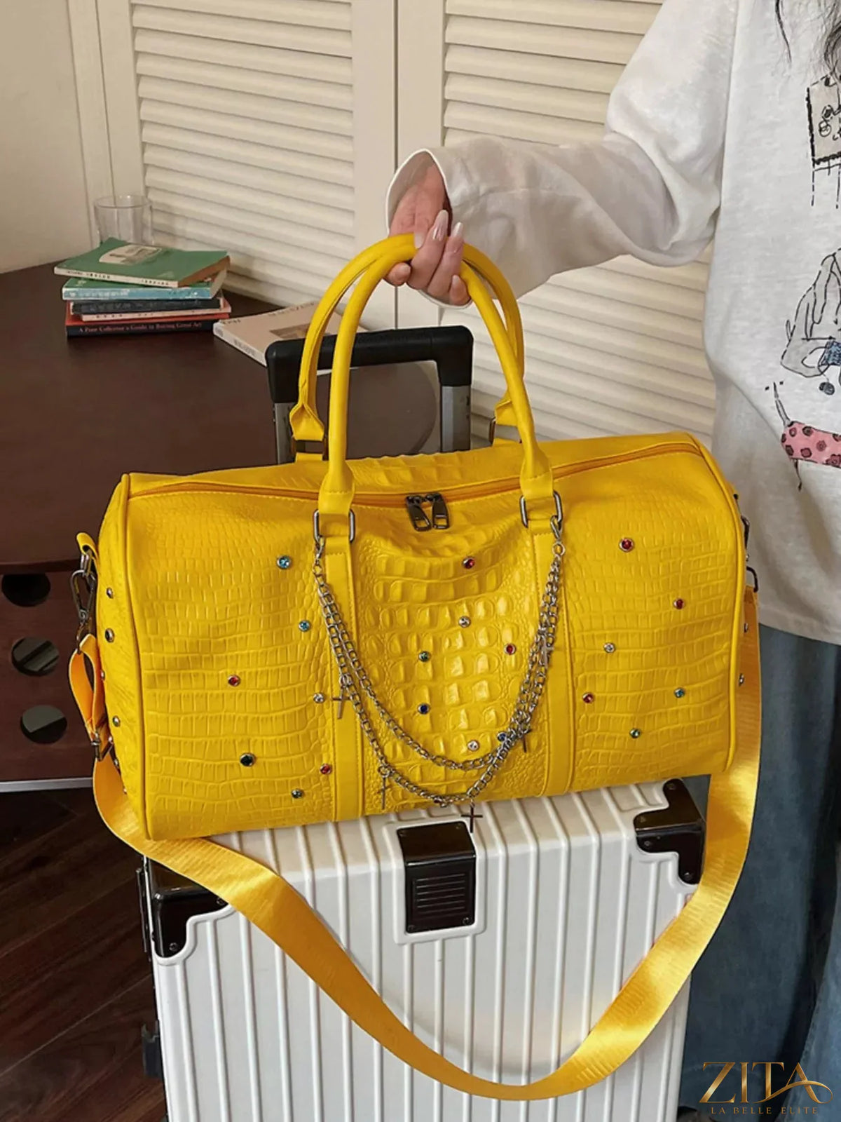 Leather studded duffel bag by Trendsi with metal studs, sturdy handles, and spacious interior for travel and weekend trips.