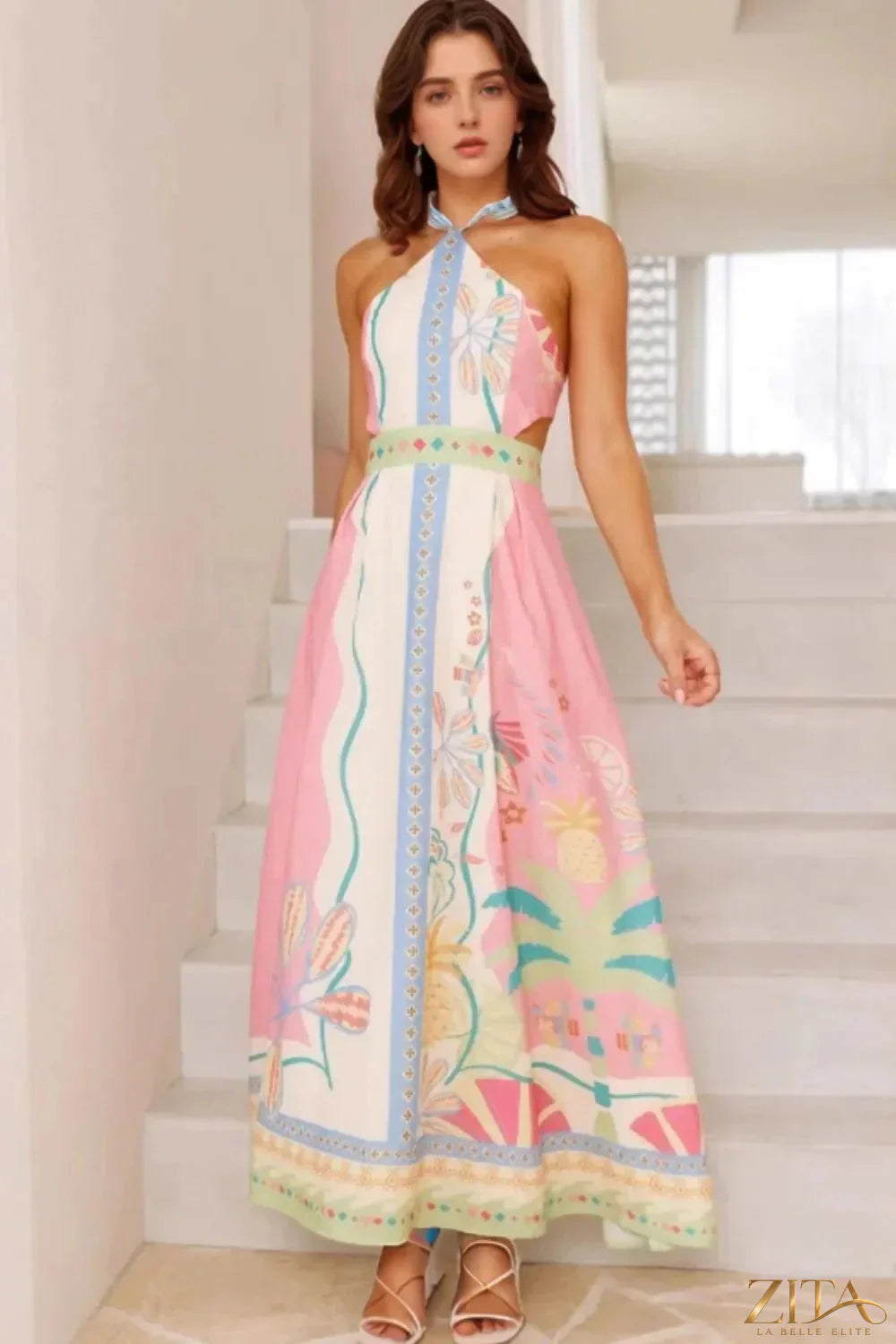Printed halter neck maxi dress by Zita La Belle Elite, flowing fabric with vibrant floral pattern and elegant design