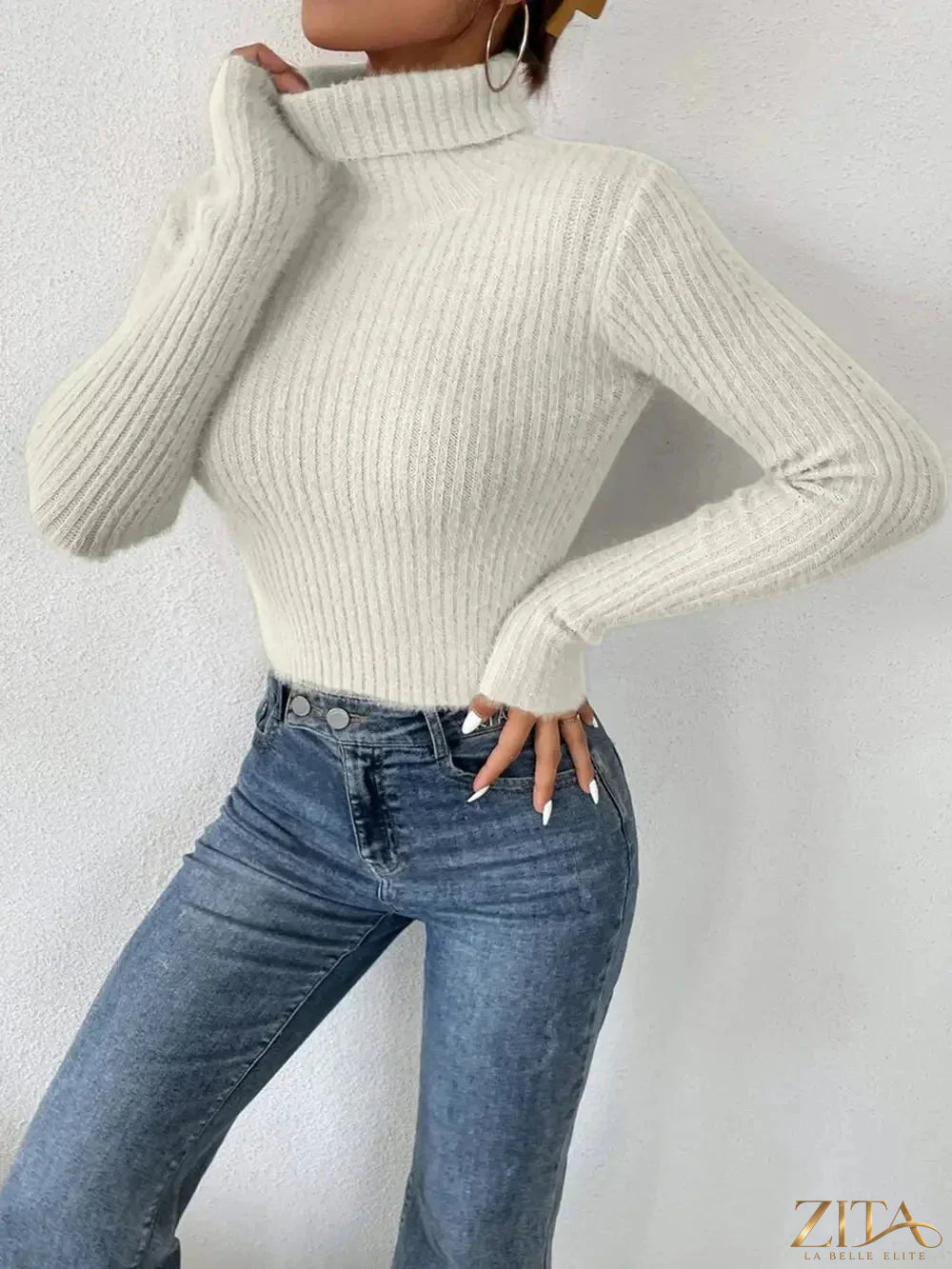 Ribbed Trendsi turtleneck sweater with long sleeves, fitted design, in a neutral color, displayed on a mannequin.