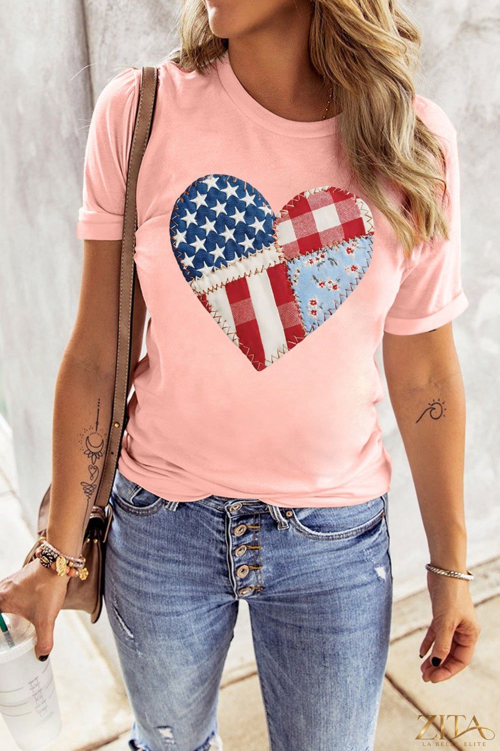 Red and white patriotic heart round neck T-shirt by Trendsi, featuring a bold heart design on soft cotton fabric.
