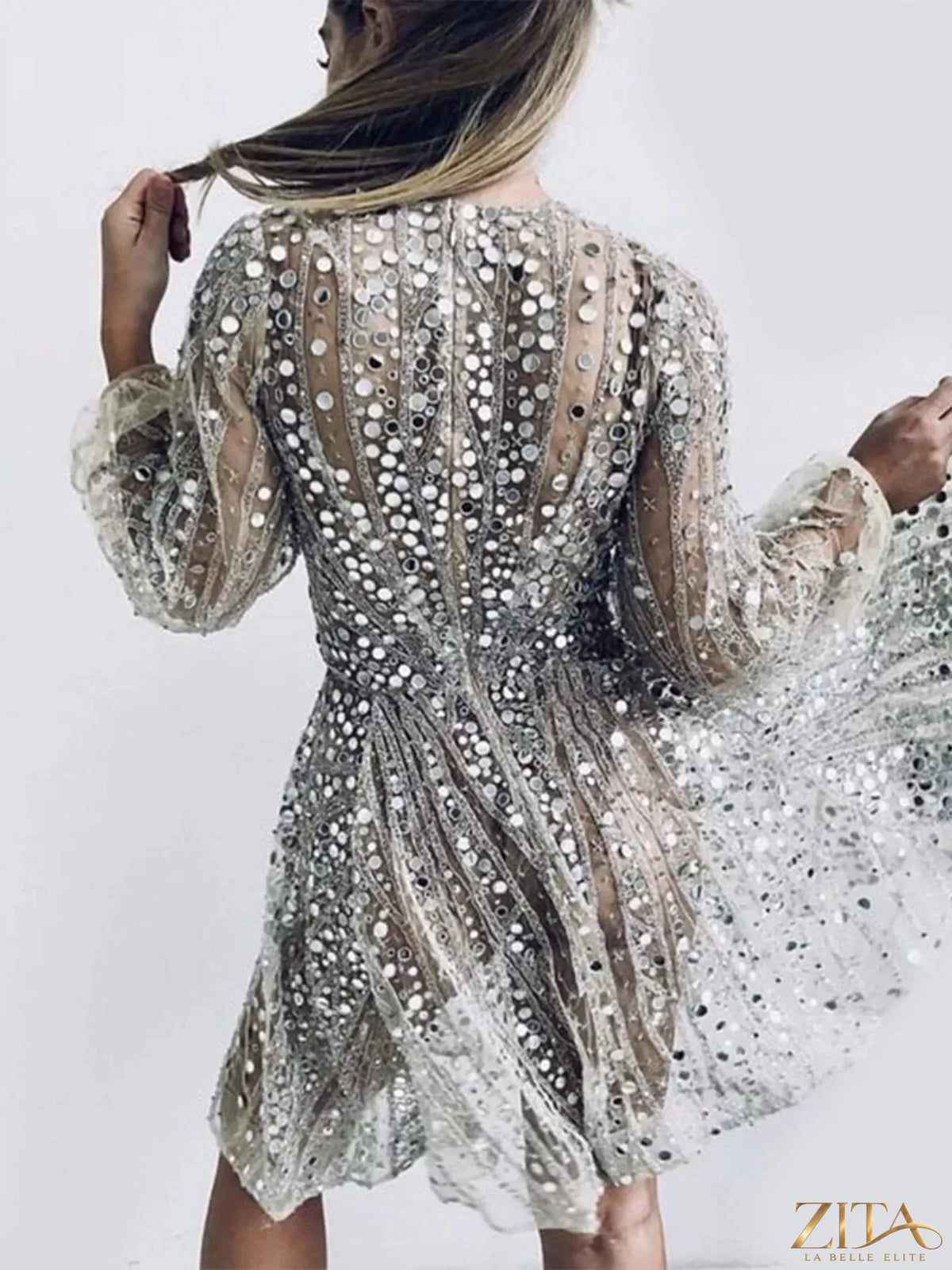 Zita La Belle Elite sequin deep V-neck mini dress featuring shiny sequins and a fitted silhouette, perfect for evening wear.