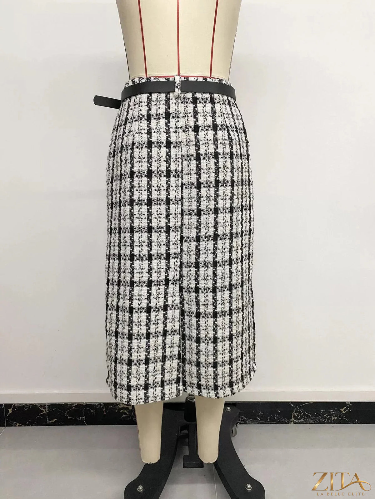 High-waisted tweed plaid midi skirt by Zita La Belle Elite, featuring a classic pattern and tailored fit for stylish elegance.