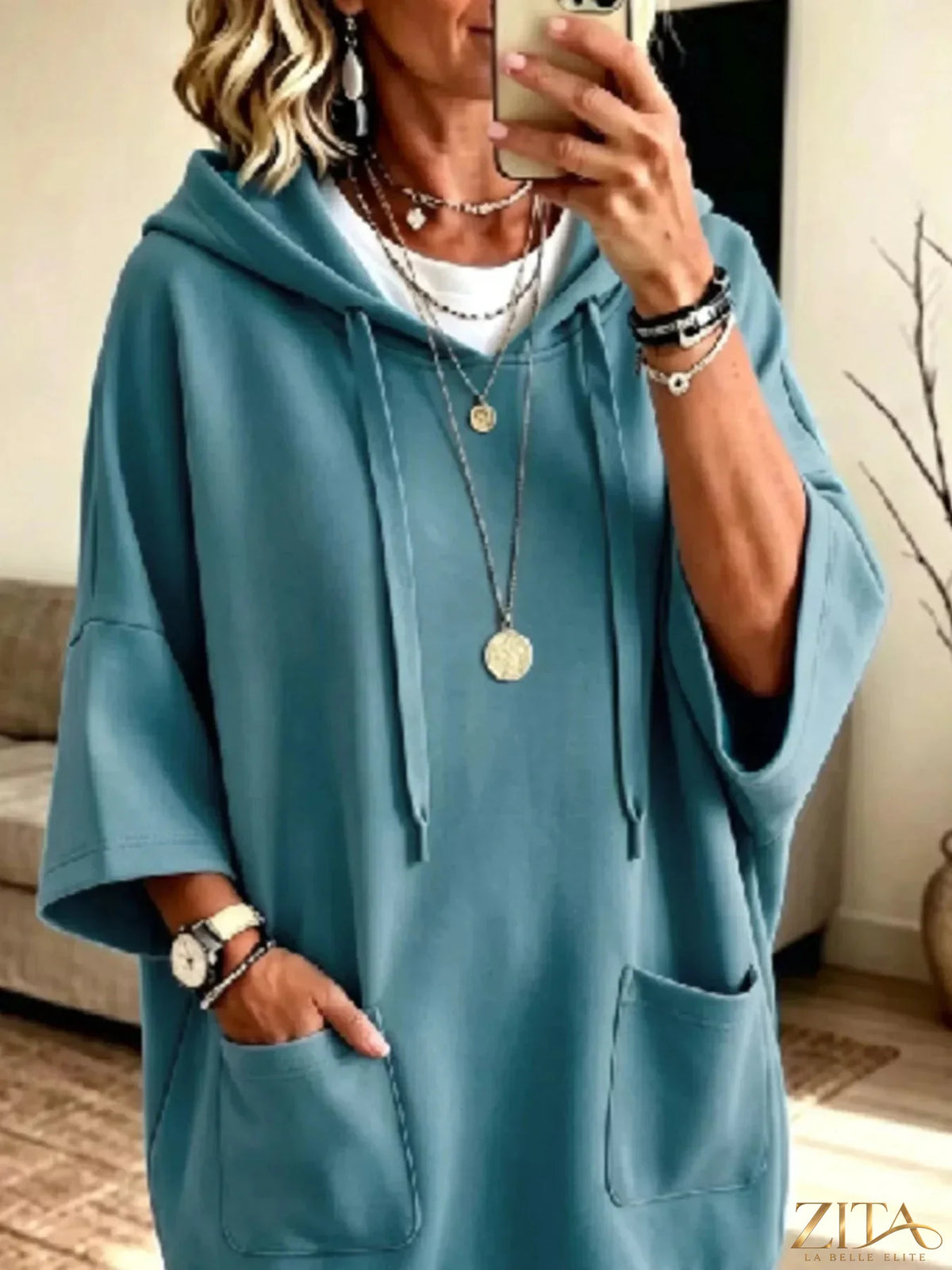 Plus size oversized drawstring hoodie with front pockets by Zita La Belle Elite, shown in a comfortable, relaxed fit style.