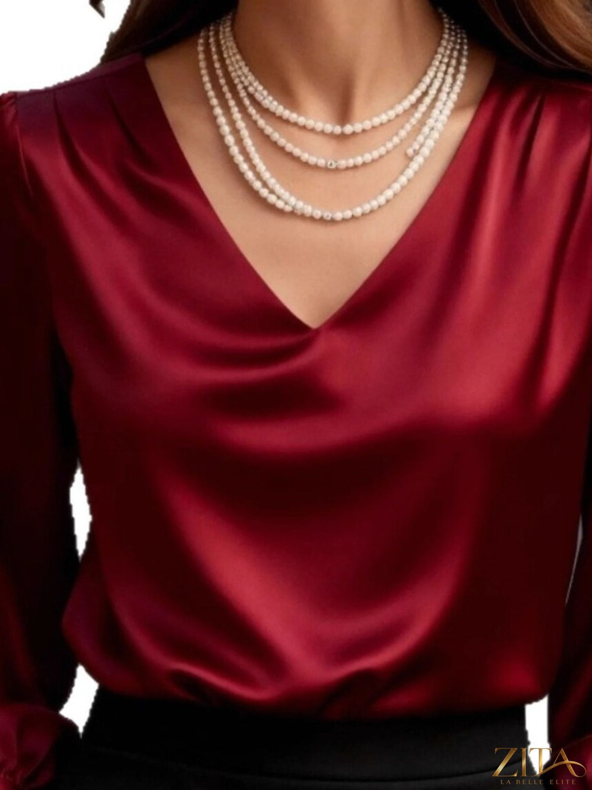 Zita La Belle Elite satin V-neck long sleeve blouse in elegant, smooth fabric, displayed on a neutral background.