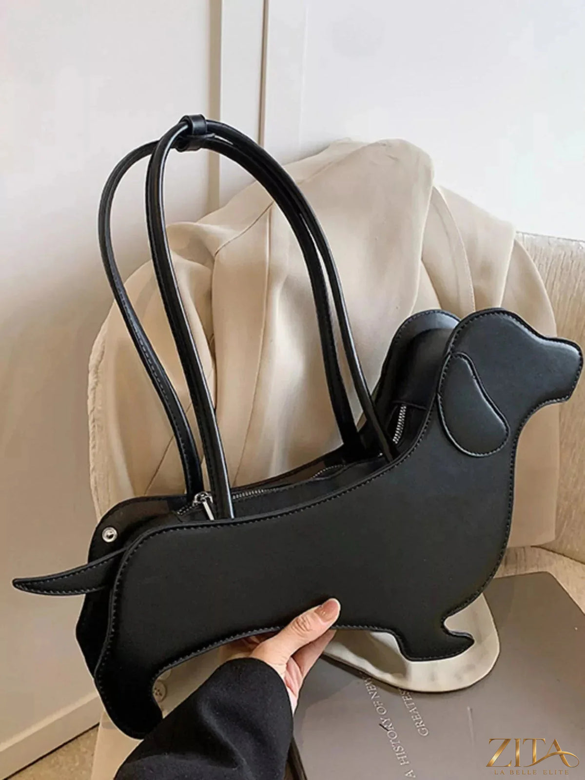 Zita La Belle Elite dachshund-shaped shoulder bag in beige with detailed features and a strap for stylish carrying.
