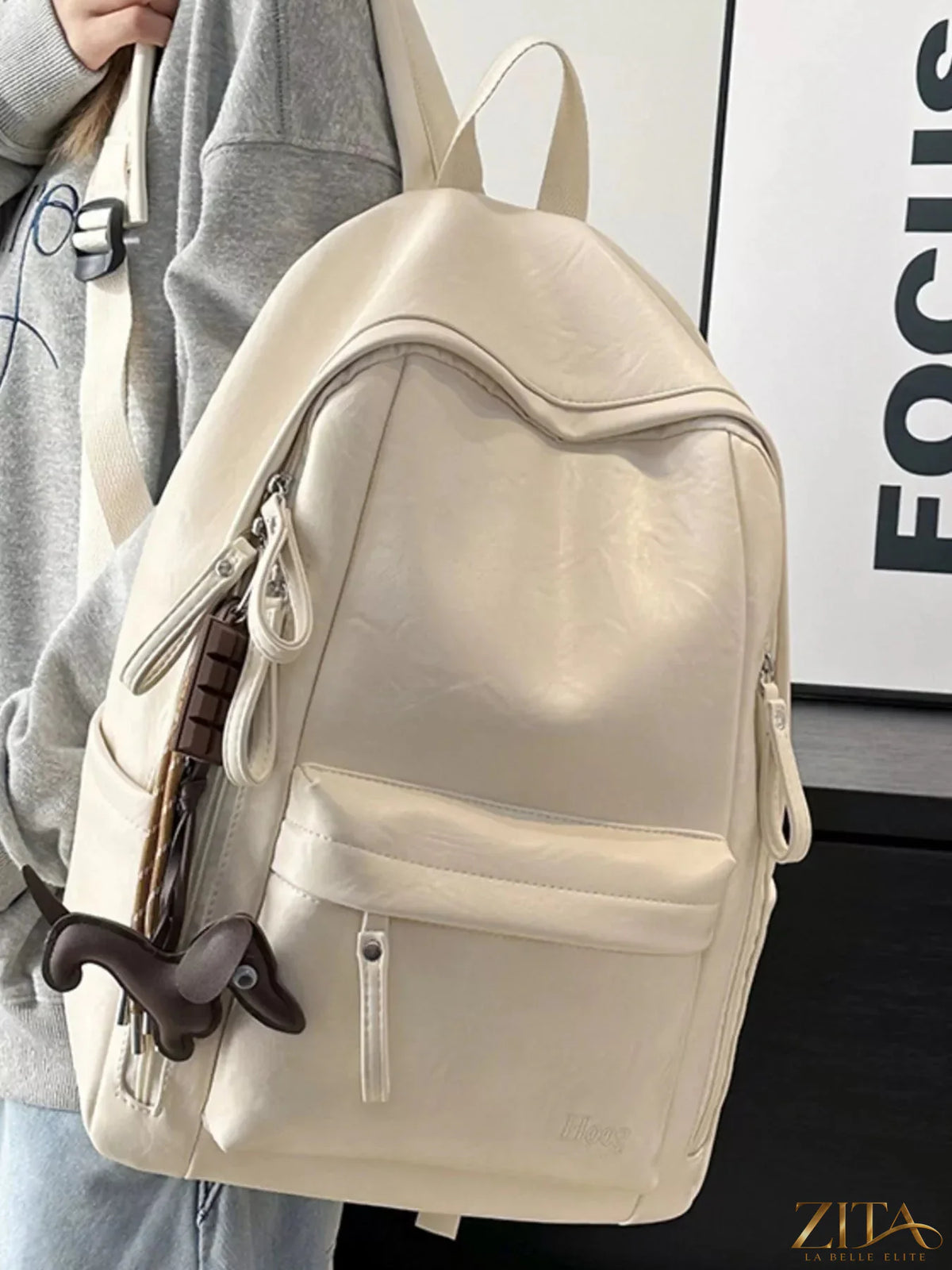 Leather texture backpack bag with adjustable straps and multiple compartments, designed by Trendsi for a stylish, functional look.