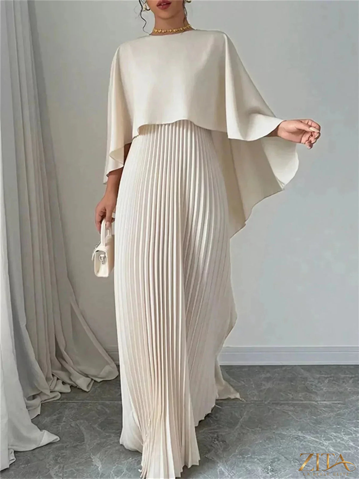 Elegant navy blue cape pleated maxi dress by Trendsi featuring flowing fabric and a stylish, sophisticated design.