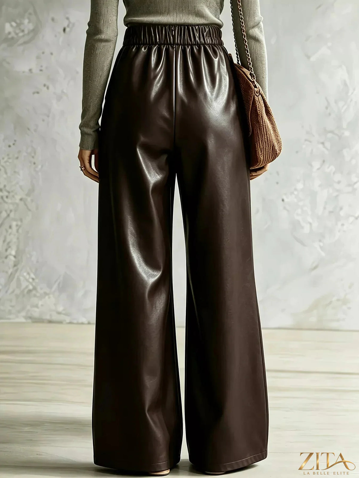 Zita La Belle Elite criss-cross wide-leg pants in black fabric, featuring a high waist and flowing silhouette.